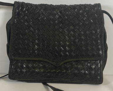 Bottega Veneta Black Woven Leather Shoulder Bag: Bottega Veneta black woven leather shoulder bag, late 20th c., soft woven leather using intrecciato weaving technique, foldover flap with tassel, interior with zip pocket, gold nameplate "Bottega Vene