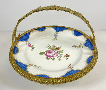 19th Century Meissen Bronze Mounted Center Plate: Hand painted floral plate with bronze surround and basket handle. Measures approx 8 inches high, 10.25 inches wide. Overall good condition, no chips or cracks. Please see photos.