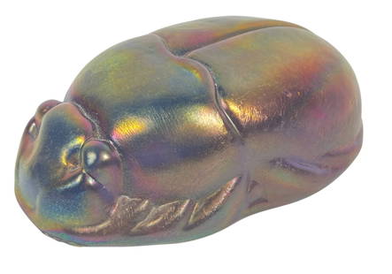 Tiffany Studios Favrile Scarab Paperweight: Tiffany Iridescent Favrile Glass Scarab. Unsigned. Measures 4.5 inches long, 2.875 inches wide, 1.5 inches high. Overall good condition, no chips or cracks.