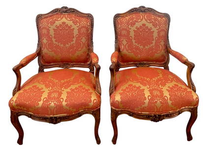 Pair French Louis XV Carved Walnut Arm Chairs: Upholstered in red/gold silk. They measure 41.5 inches high, 28 inches wide, 24 inches deep. Overall good condition, please see all photos.