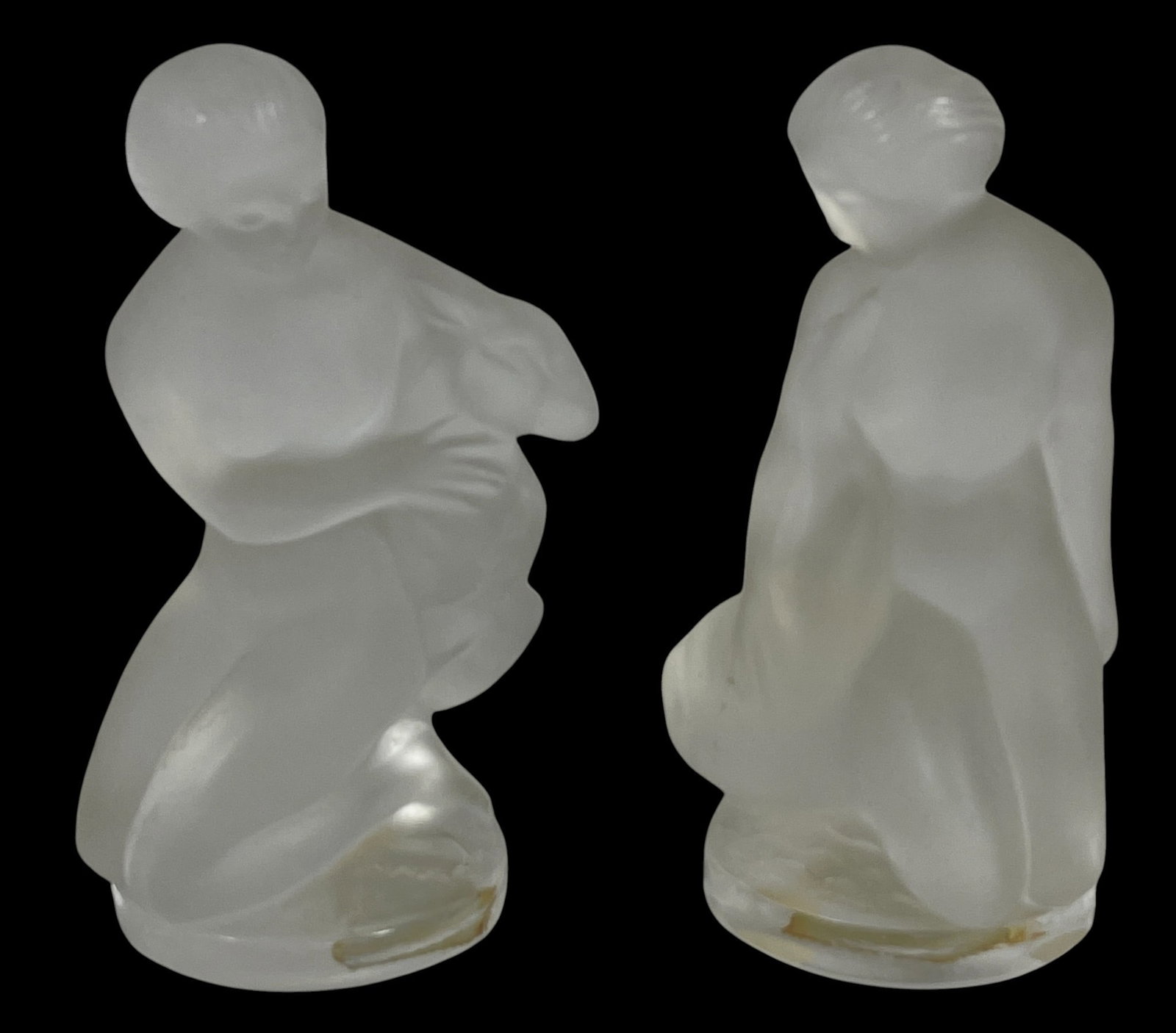 (2) Lalique Frosted Nude Figurines Diane with Ram & Leda with Swan: Lalique France frosted crystal glass nude figurines - Diane with ram & Leda with swan. Marked "Lalique France" to the edges. Measure aprox 4.5 inches high. Overall good condition, no chips or cracks