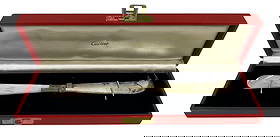 Vintage Cartier Sterling Silver & MOP Cheese Knife: Comes in original box. Measures 7.75 inches long. Overall good condition, please see photos. Comes from a mid town Manhattan estate.