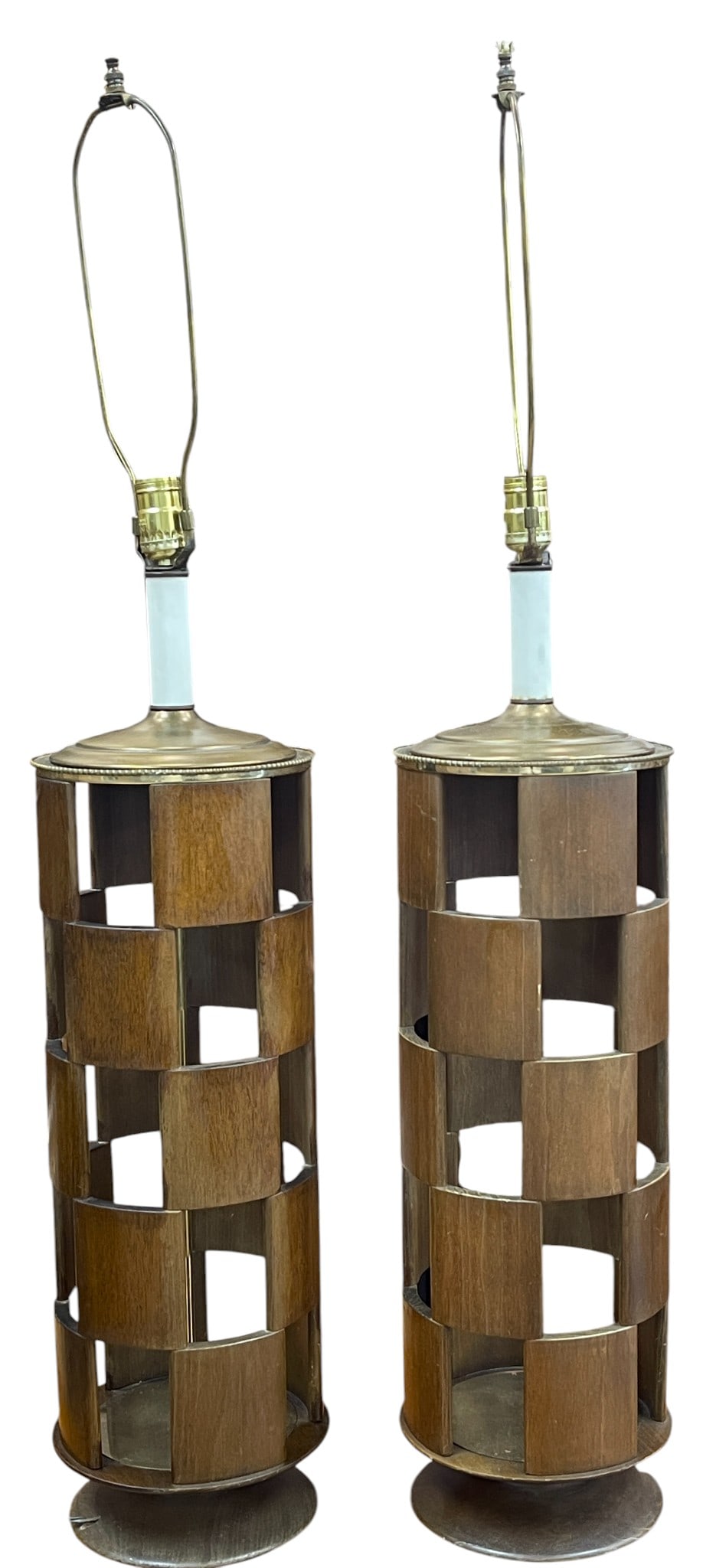 Pair Mid Century Walnut Checkerboard Lamps: Wooden checkerboard lamp with brass fittings, circa 1960. Measures 31 inches to the top of the socket, 8.75 inch diameter. Overall good condition. Working at time of listing, lighting is not guarantee