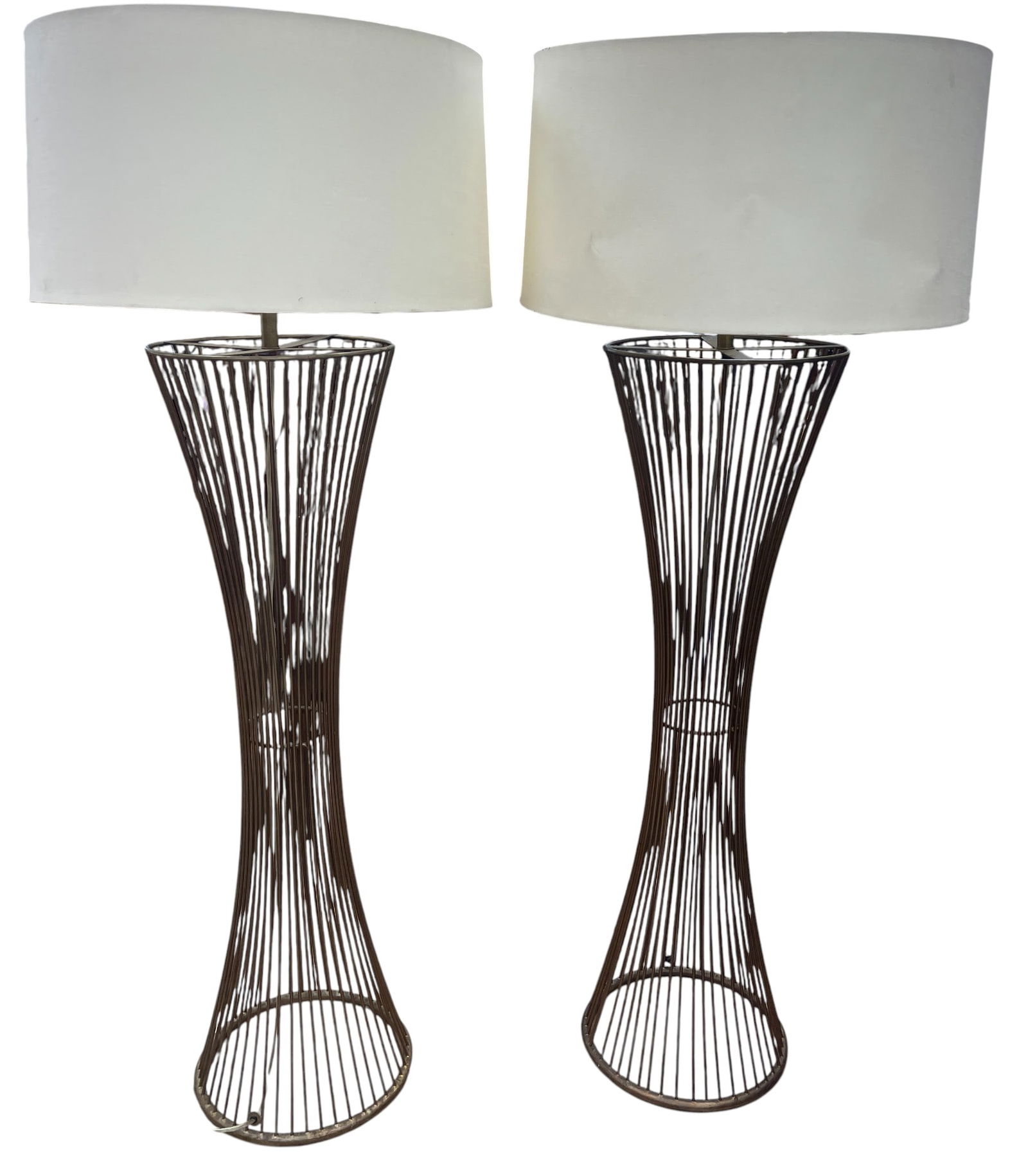 Pair Modern Hourglass Metal Floor Lamps: Shades are marked Tanner Kensie, not sure if original. Lamps measure to the top of the socket 54 inches, shade measures 25 inches in diameter. No signature found. Overall good condition, please see ph
