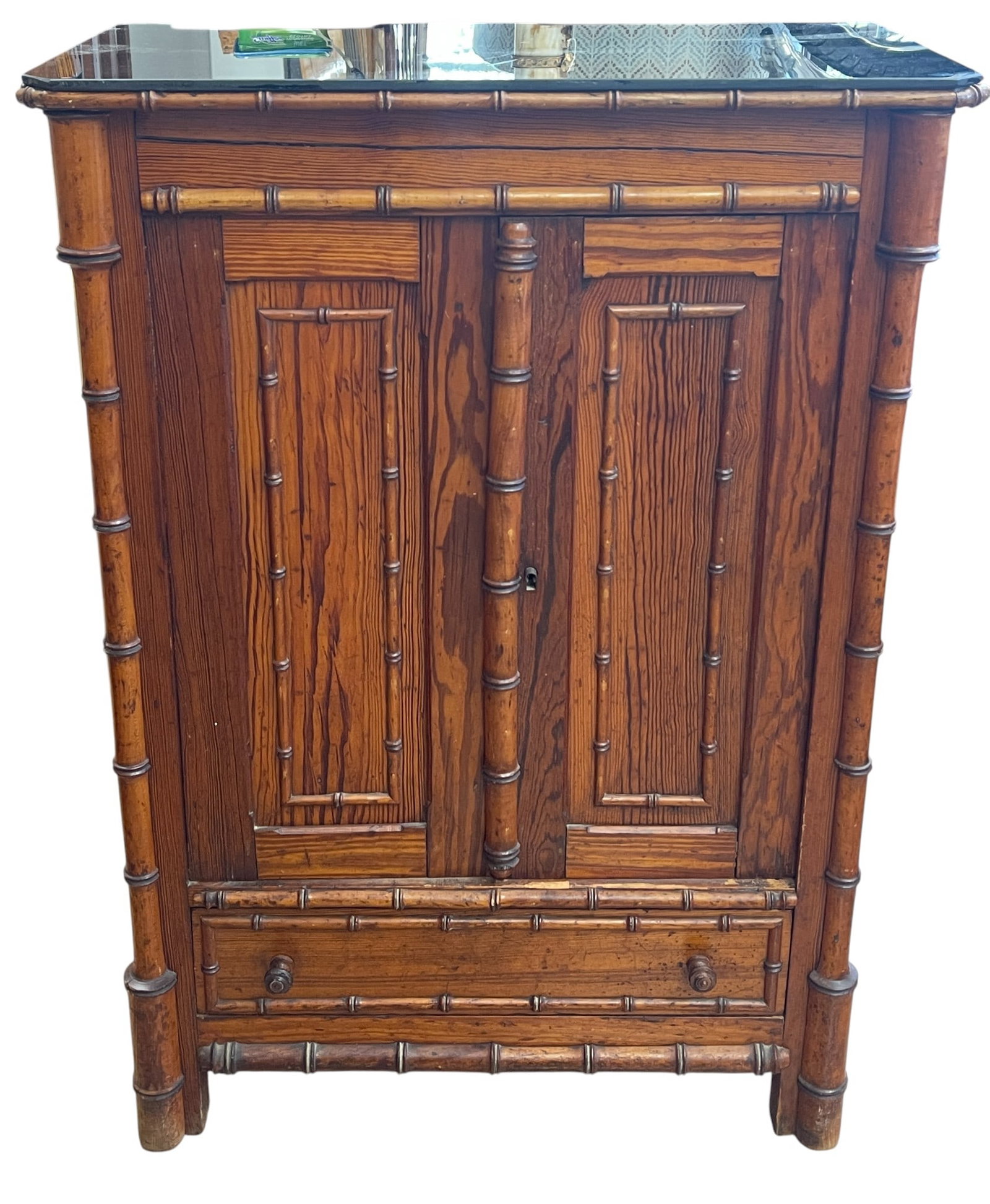Victorian Faux Bamboo 2 Door Cabinet: Has glass top, possibly replaced. Two doors, one drawer. Measures 36.5 inches high, 24 inches wide, 13 inches deep. Overall good condition, some splitting. Please see photos. Provenance from a mid tow