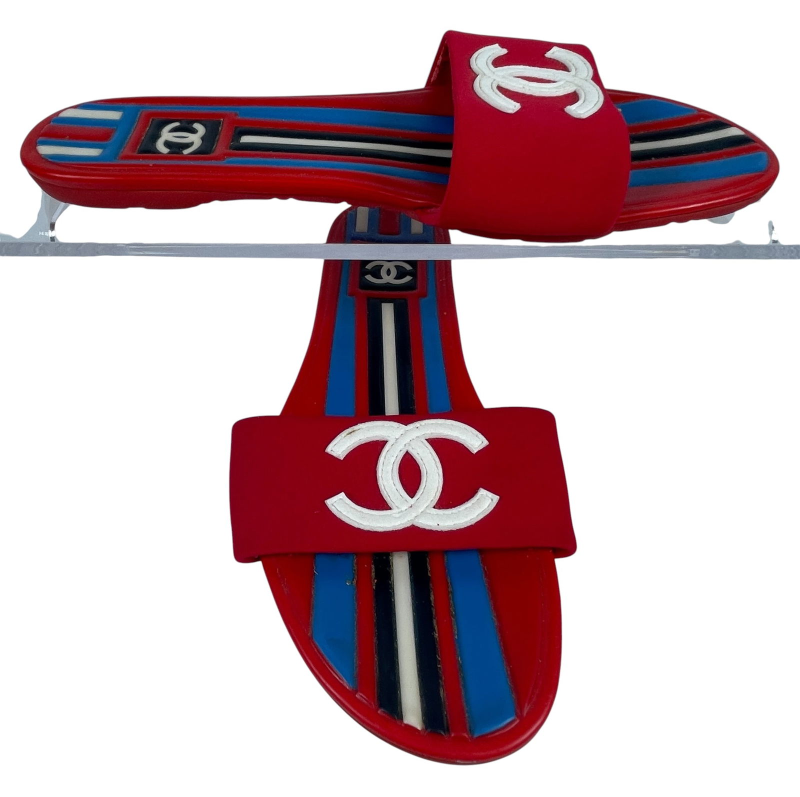 Vintage Chanel Red & Blue Stripped Rubber Mules Slides: Comes with original box and dust jacket. Size 37.5. Overall good condition, some flaking to the inside, please see photos. Provenance from a mid town Manhattan estate.
