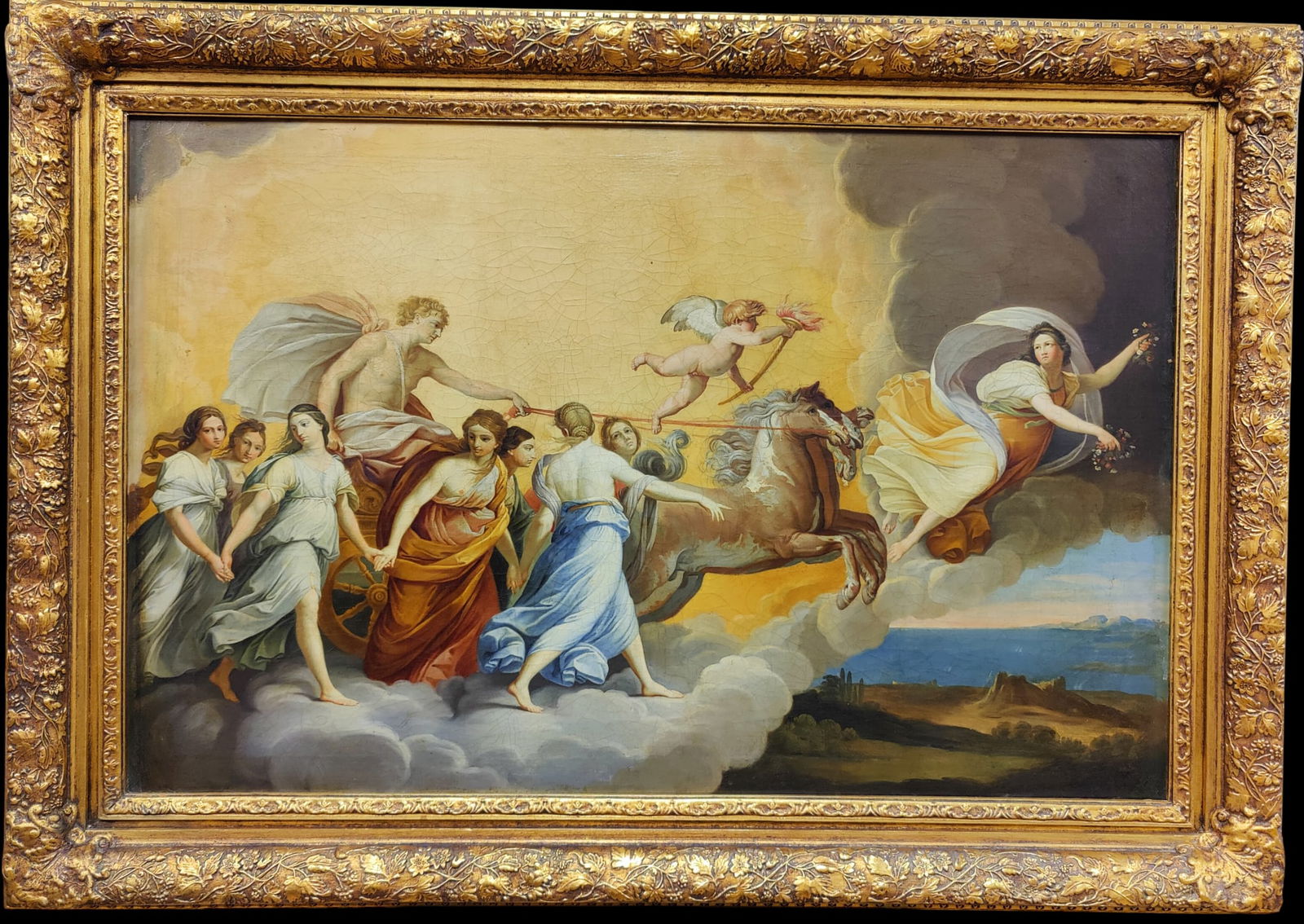 After Guido Reni O/C Triumph of Aurora, Goddess of Dawn: Mid 19th c. Italian School O/C painting which depicts from right to left, Aurora (Dawn) in a golden billowing dress with her garlands flying over a dim-lit landscape, leading a blond Apollo in his hor