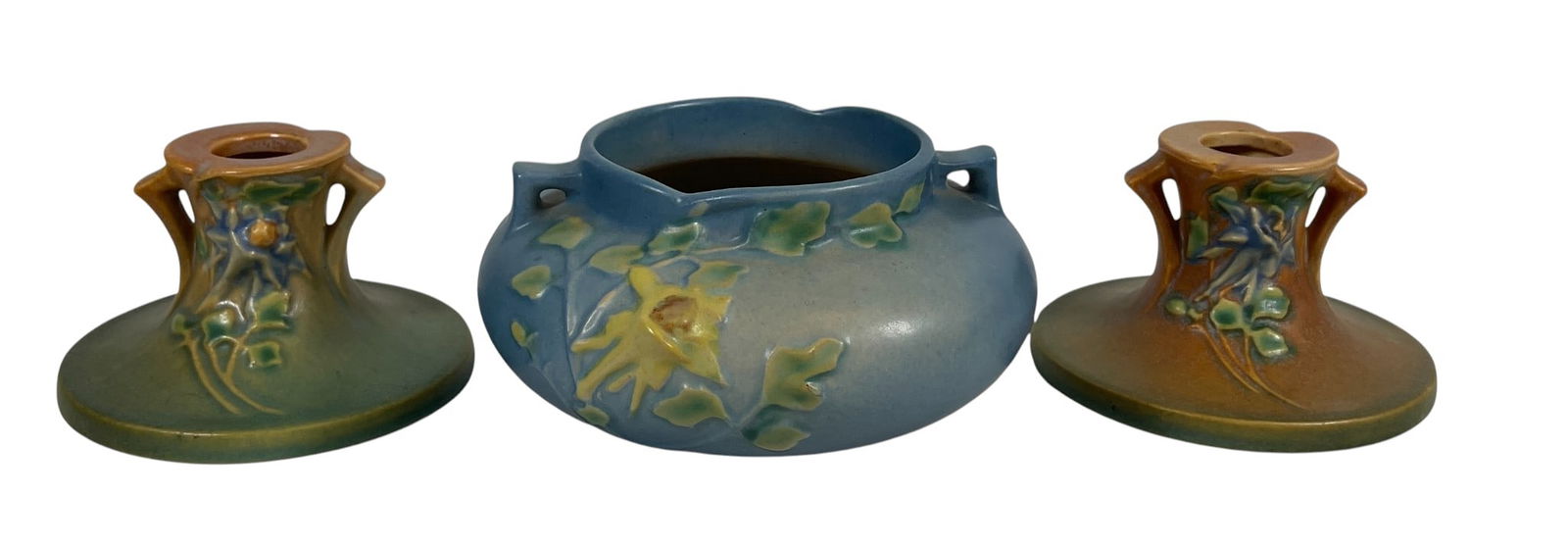Lot of (2) Roseville Art Pottery Articles: To include a pair of Columbine candlesticks (114-5), and (1) Columbine Jardiniere (655-3). Overall good condition, no chips, cracks, breaks or repairs. Please see photos.