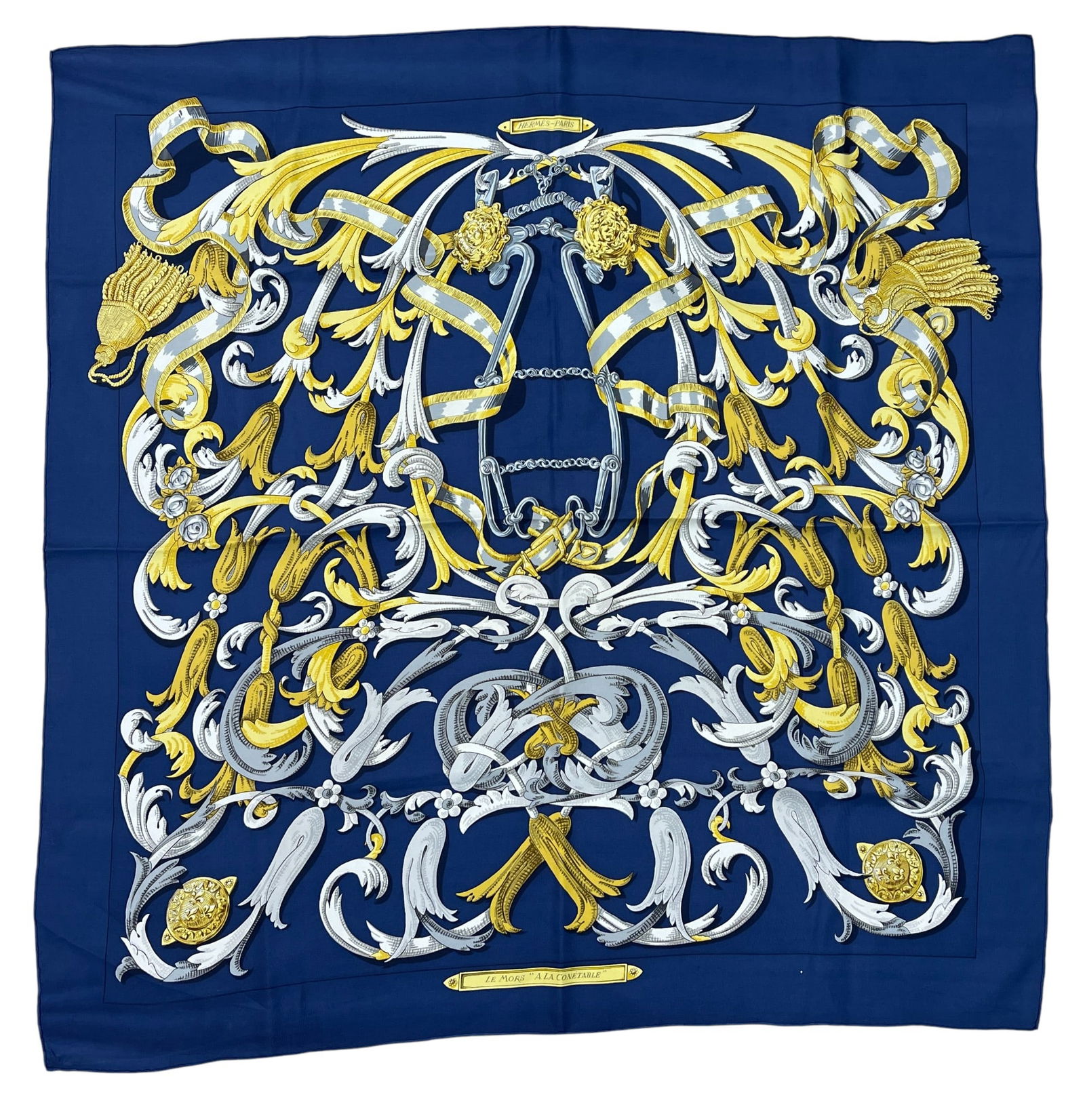 Hermes Le Mors a la Conetable Silk Scarf: Navy blue ground, measures 90cm x 90cm. Bonwit Teller label. Overall excellent condition. Provenance from an upper east side Manhattan estate.
