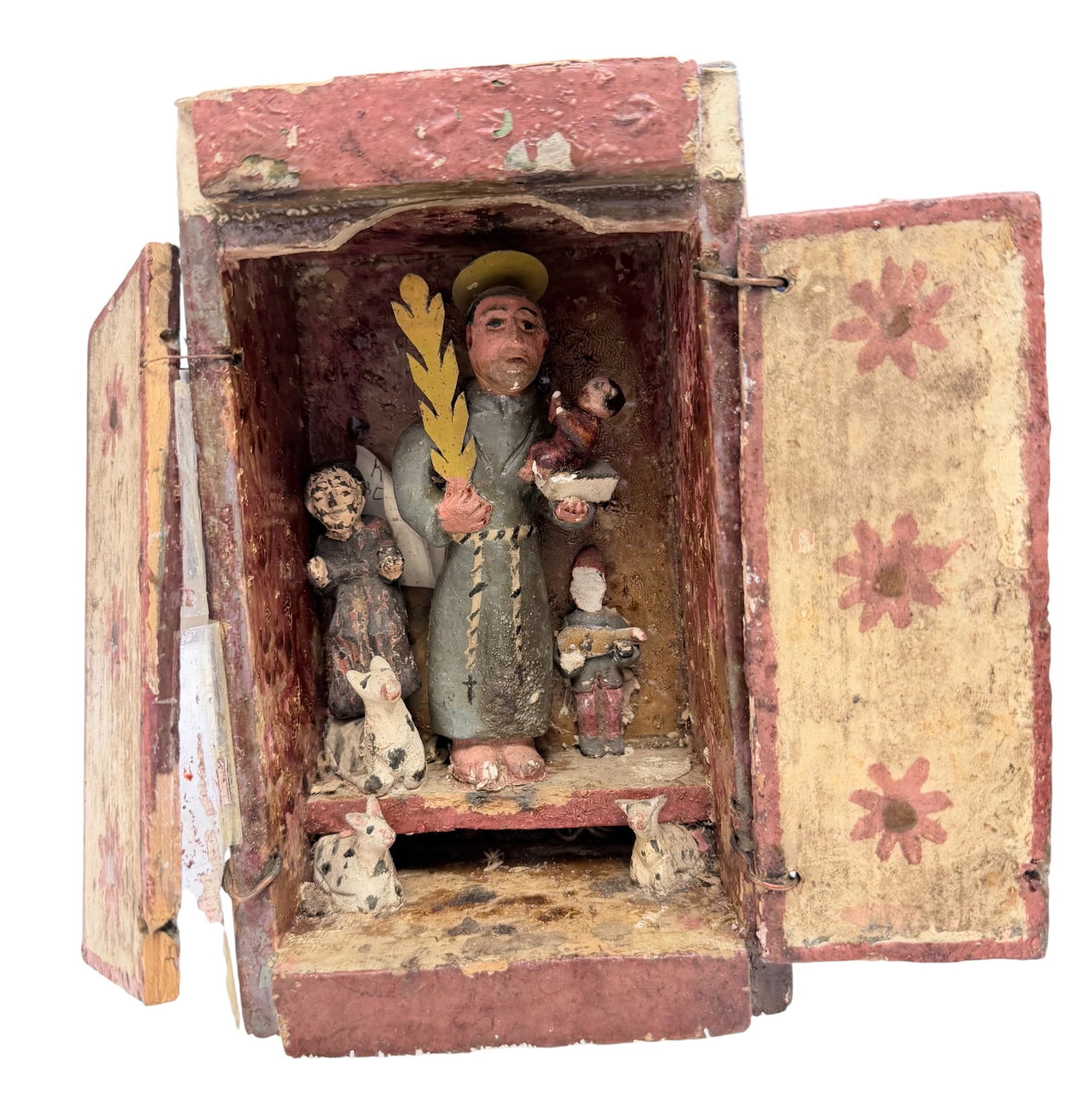 19th Century Carved Wooden Santo Figure of Saint Anthony of Padua: Holding baby Jesus, with animals. Measures 8 inches high, 4.625 inches wide, 3.25 inches deep. Overall fair condition, damage to a face, and doors. Please see photos.