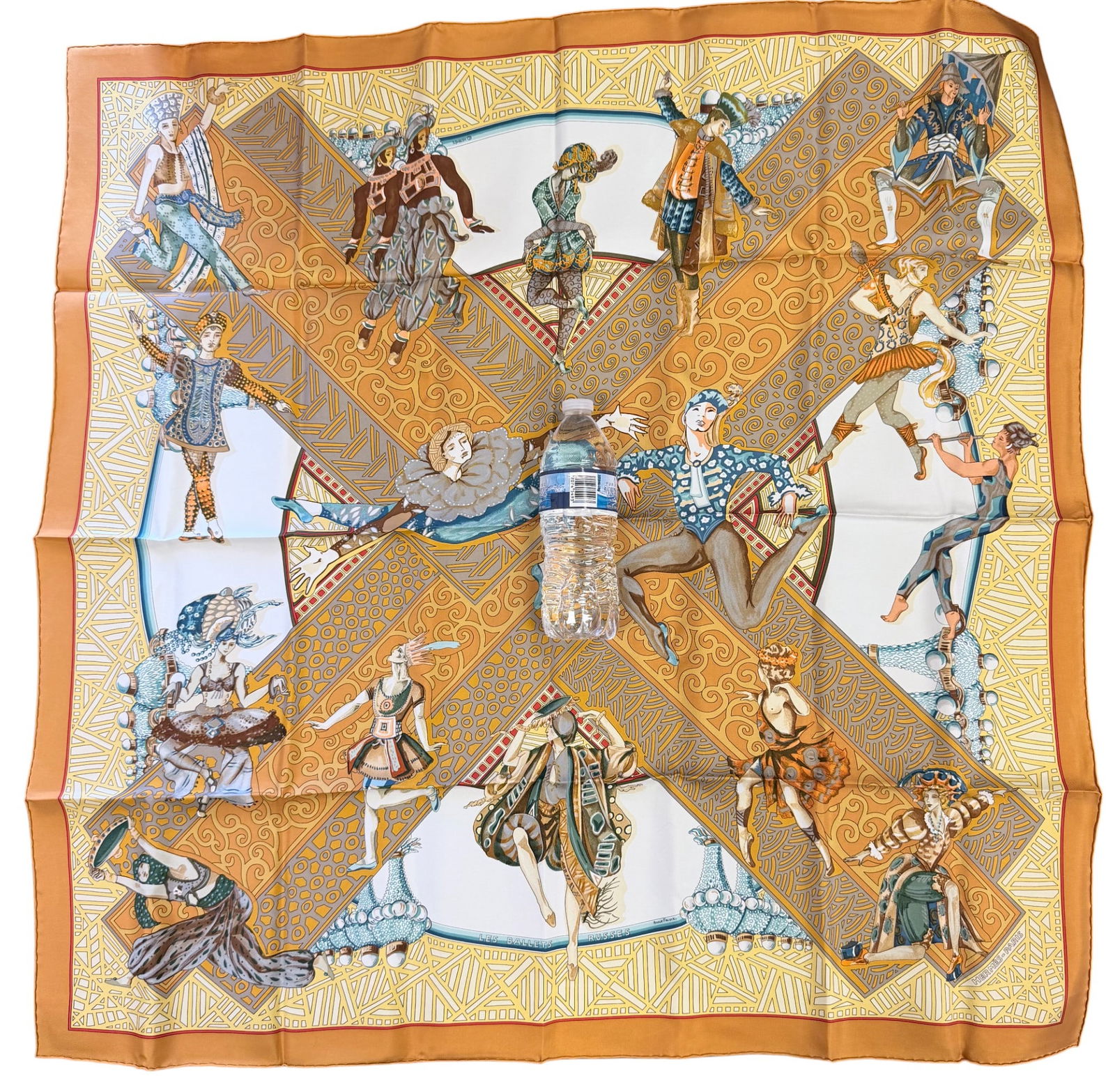 Hermes Les Balles Russes Silk Scarf Annie Faivre: Designed by artist Annie Faivre, the silk twill with rolled and hand stitched edges, with an orange ground. Measures 90cm x 90cm. New, never worn.