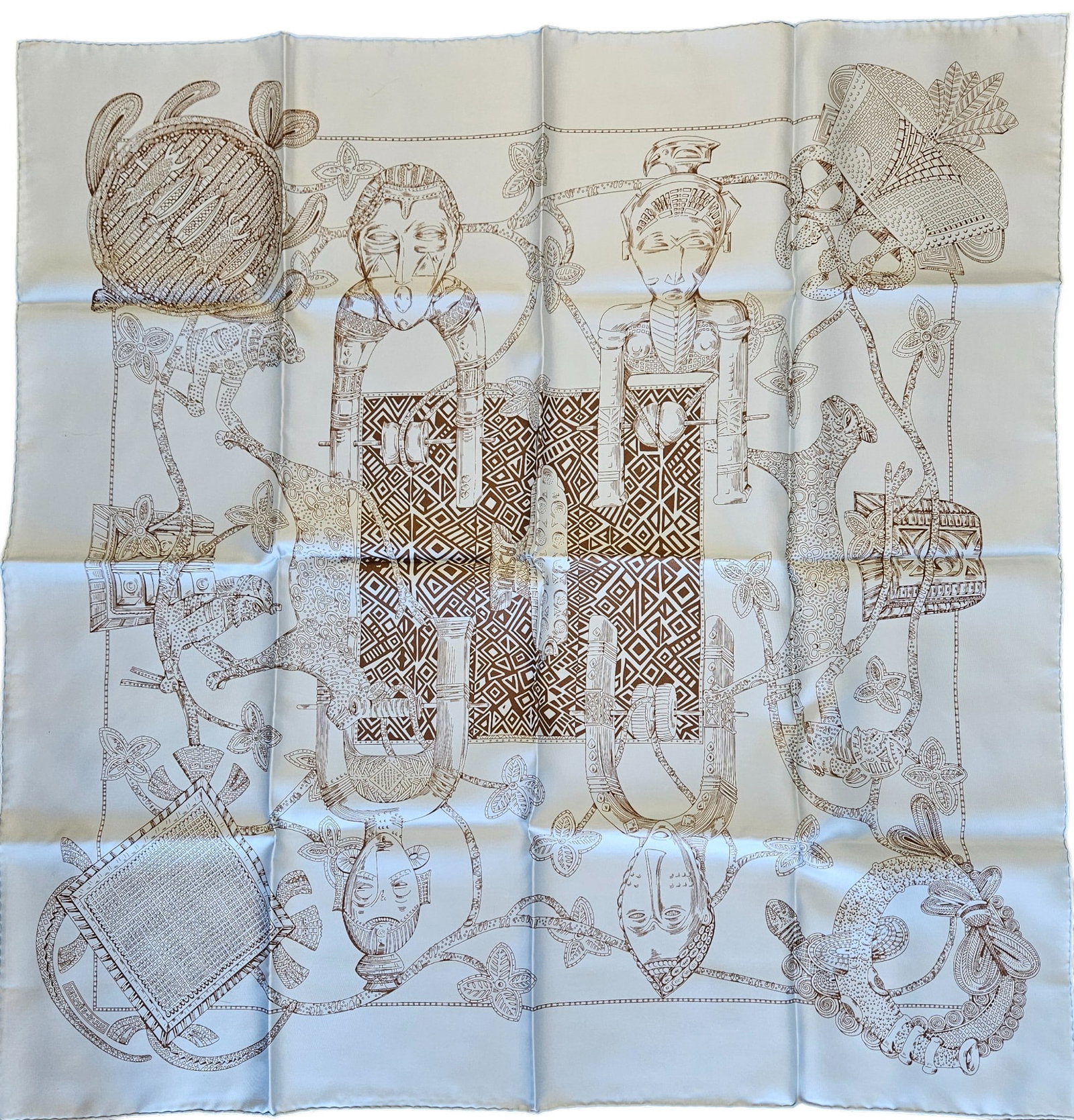Hermes Ashanti Silk Scarf Annie Faivre: Designed by artist Annie Faivre, light blue ground with brown design. Never worn, had to open the seal of the bag to photograph. Measures 90cm x 90cm.
