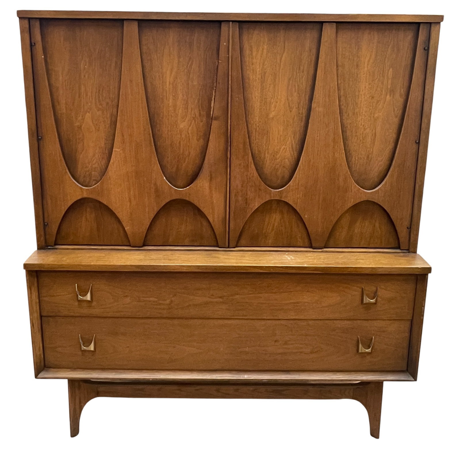 Mid Century Broyhill Brasilia Walnut High Chest: Walnut. 2 doors on top containing 2 shelves on one side and 4 dovetailed drawers on other side. 2 dovetailed drawers on bottom. 50 inches high x 44.125 inches wide x 19.375 inches deep. Overall good c