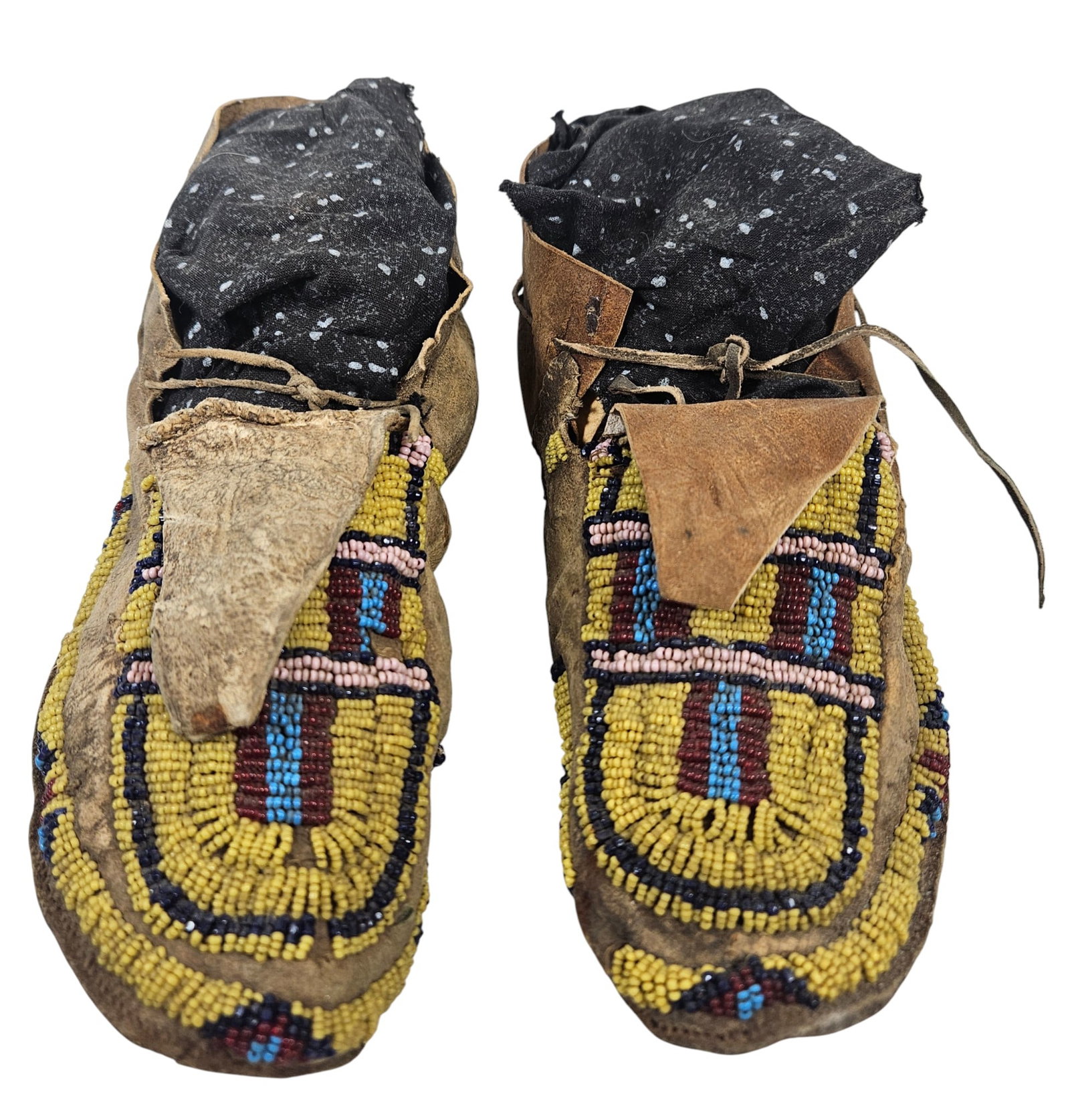 19th Century Pair Native American Plains Hide Beaded Moccasins: Sinew sewn, made from hide, with geometric beadwork. They measure approx 9.5 inches long. Overall good condition, some staining - hide is extremely stiff. please see photos.