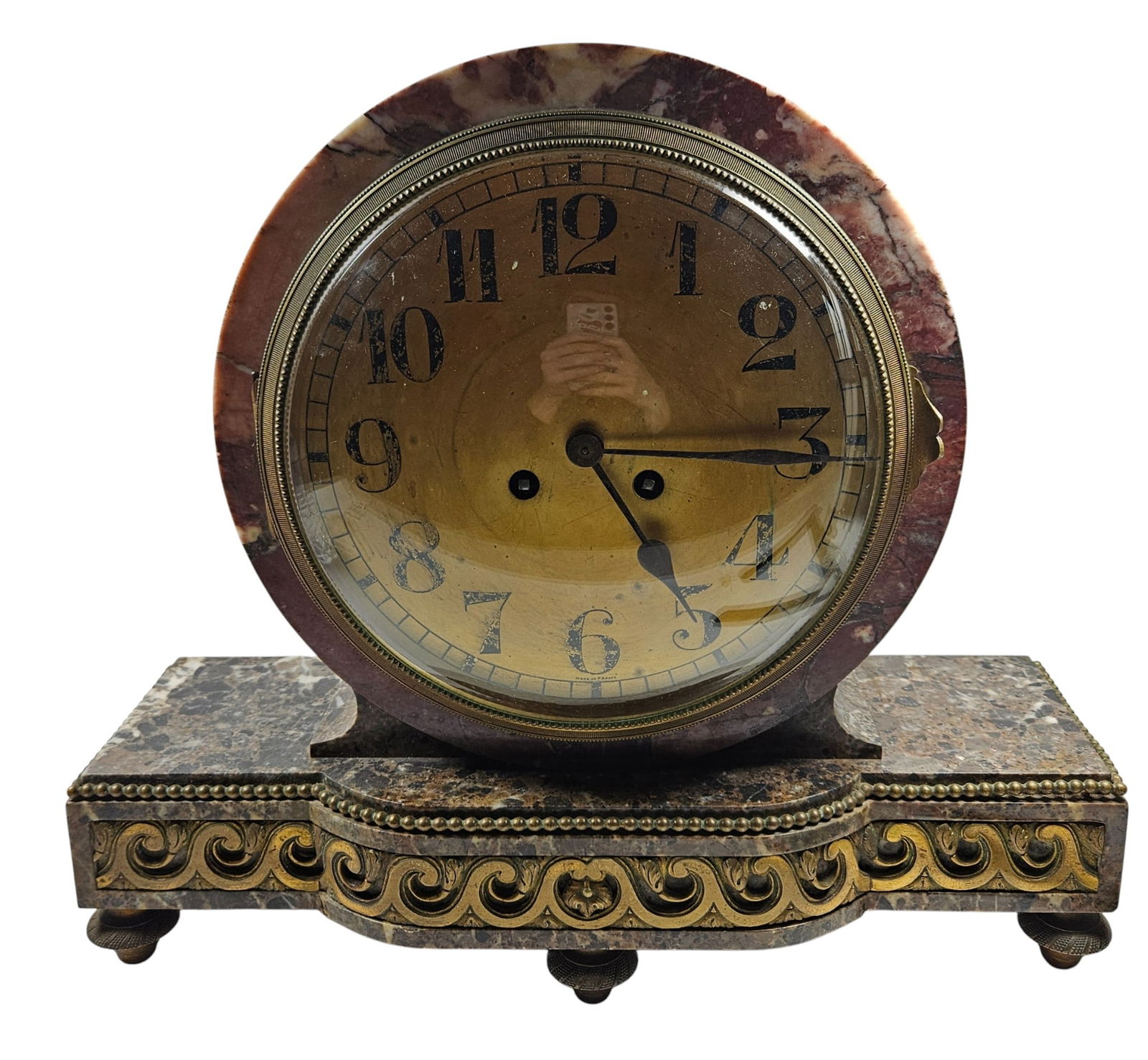 19th Century French Empire Bronze & Two Tone Marble Mantle Clock: Features a circular face set upon a rectangular base with decorative scrollwork and feet. Measures 13.5 inches high, 15 inches wide, 5.5 inches deep. Overall good condtion, no pendulum or key. Please