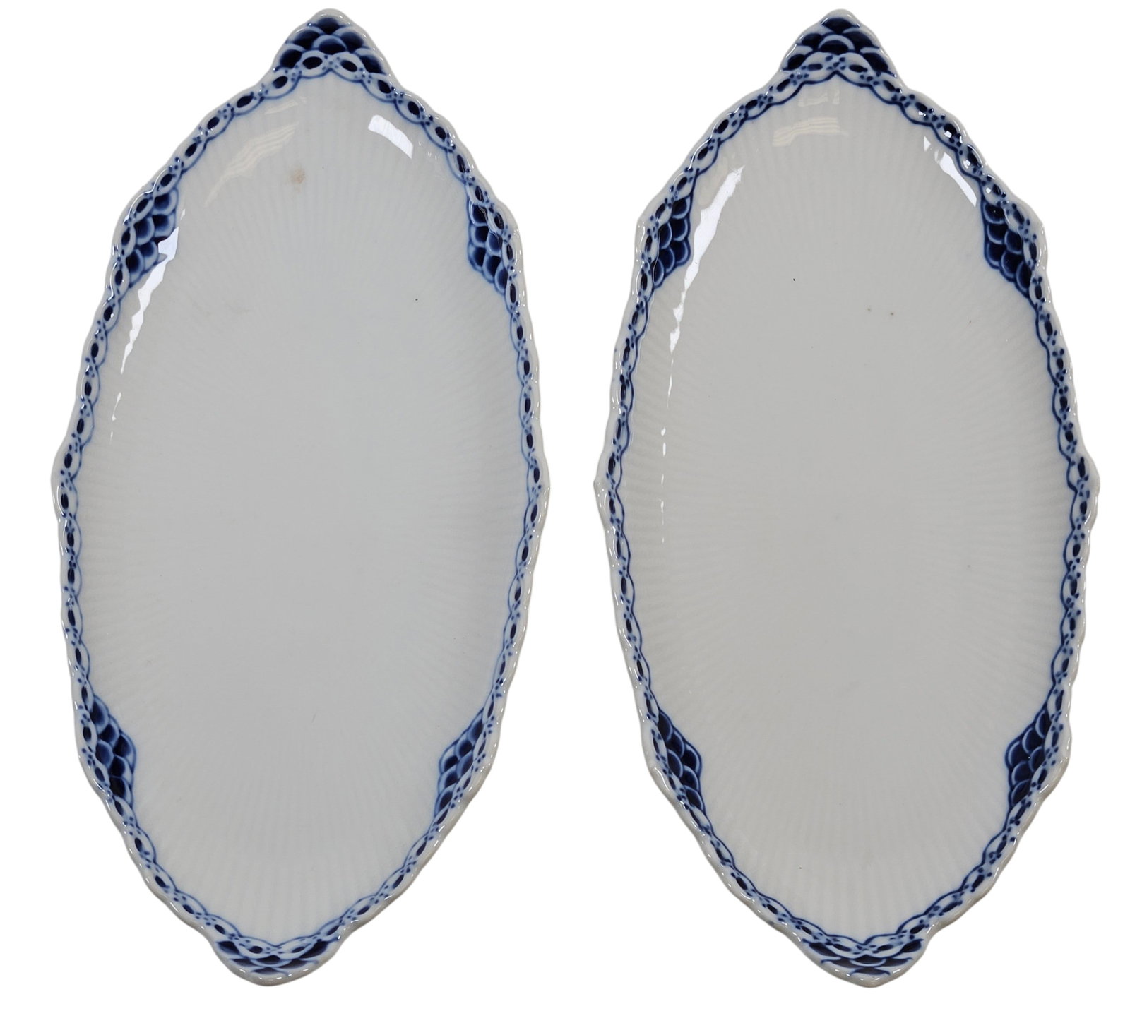 Pair Vintage Royal Copenhagen Princess Oval Accent Pickle Dishes: One dated 1975-79, the other dated 1980-84. Distinctive blue and white design with a delicate, hand painted lace border and scalloped edges. Measure approx 9.75 inches x 4.75 inches. Overall good