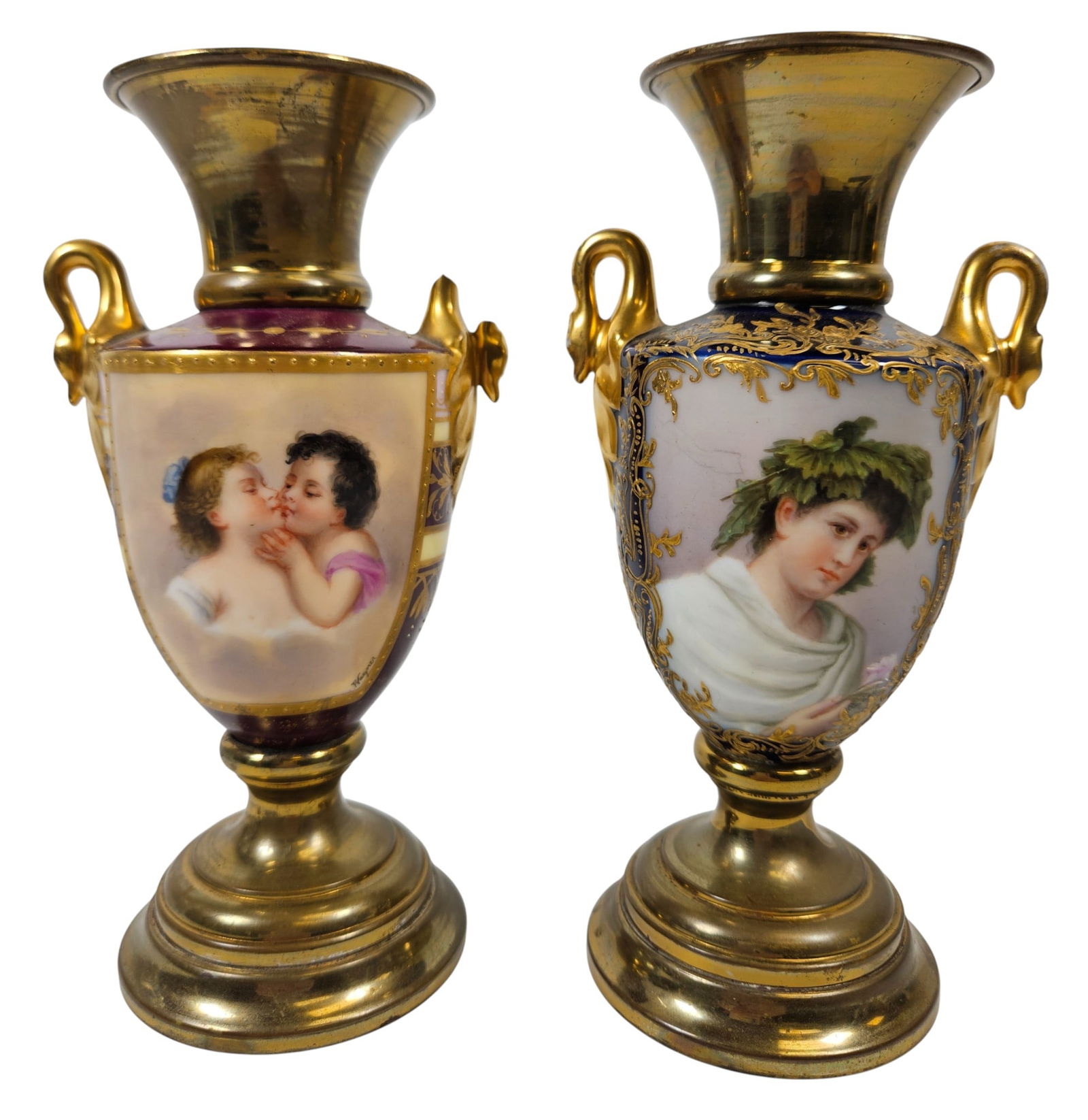 (2) Royal Vienna Porcelain Portrait Vase Swan Handles: One handle damaged, please see photos. One cobalt blue, one burdundy. Brass base and collar. Measure 7.125 inches high. Please see photos.