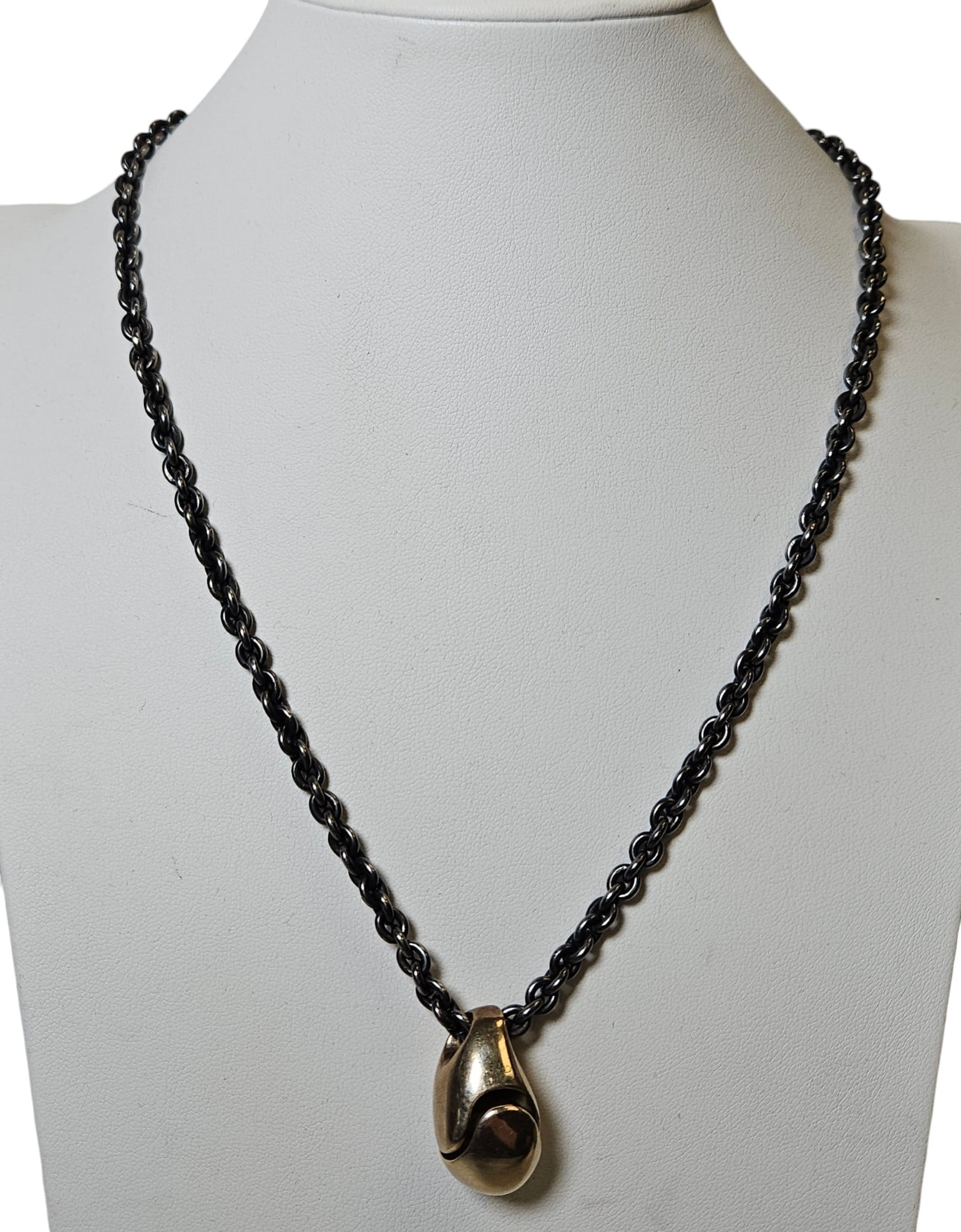 Mid Century Modernist Georg Jensen Style 14k Yellow Gold & Sterling Teardrop Necklace: Has signature, but faded. Marked 585 on pendant, 14k on heart shaped clasp. Silver chain not marked, but tested. Chain measures 20 inches long, pendant measures 1 inch long. Pendant weighs 9.4 dwt (14