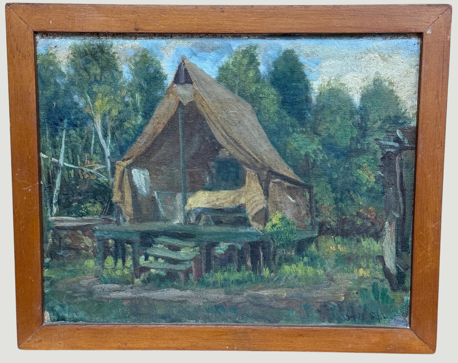 Oscar Fisher WPA Era Oil on Board Lean To Forest Landscape: A c1960s O/B depicting a rustic, open front canvas wall tent or lean-to set up on raised wooden platform with small steps, surrounded by a dense forest landscape. Framed measures 10.625 x 13 inches,