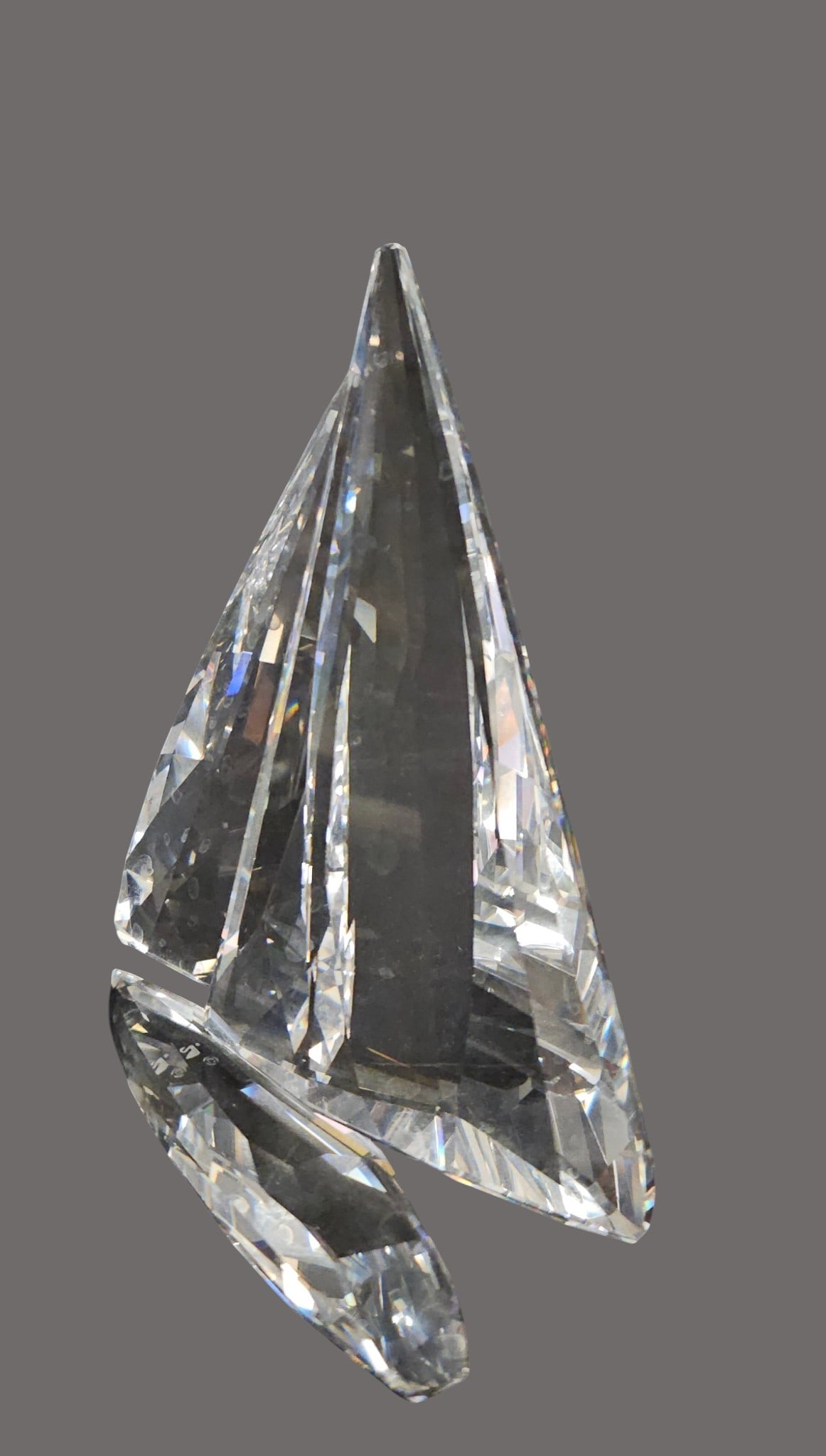 Swarovski Crystal Sailing Legend Sailboat: Sparkling clear faceted crystal figure of a sailboat. Swarovski mark. Includes original red lined box and paperwork.