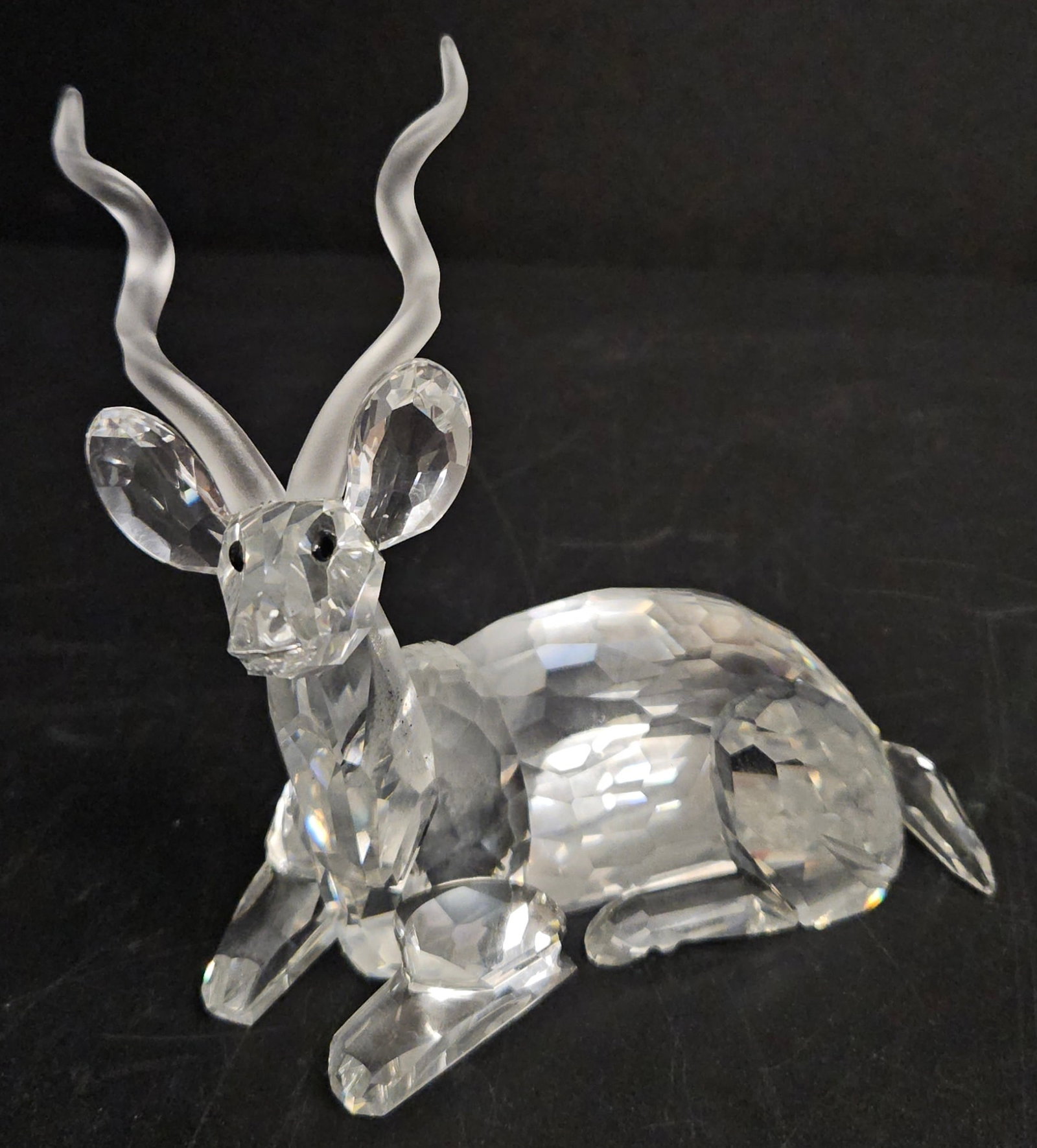 Swarovski SCS Crystal 1994 African Series Kudu: Stunning Swarovski SCS Kudu crystal figurine, the 1994 Annual Edition from the Inspiration Africa series. Designed by Michael Stamey, this elegant piece features a reclining kudu crafted from clear