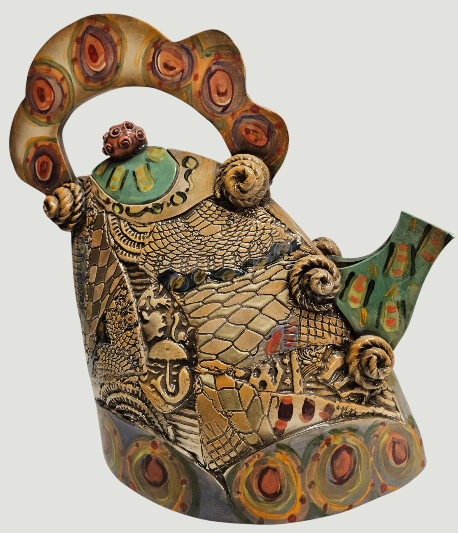 Gail Markiewicz Ceramic Teapot: A whimsical glazed ceramic teapot sculpture by Gail Markiewicz, signed on base. From the designers website: This hand built ceramic piece uses a unique process where I press antique and contemporary