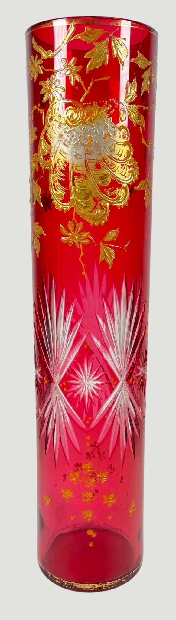 Moser Bohemian Enameled Cut Glass Vase: Gold floral and leaf enamelling on cranberry ground cut to white. Vase measures 14 inches high, 3 inches in diameter. Overall good condition, no chips or cracks but some minor gilt loss.