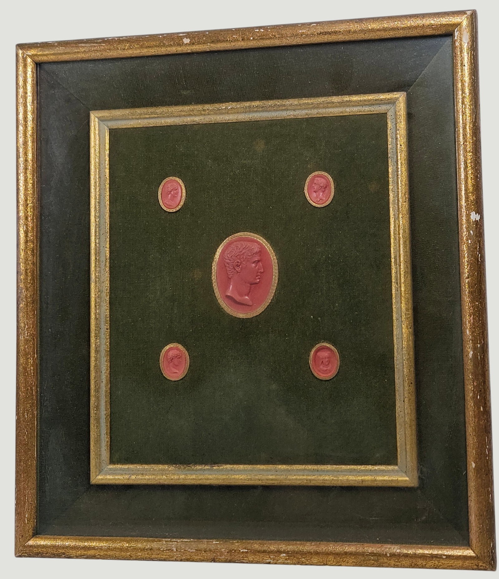 (5) 19th Century Grand Tour Wax Intaglio Medallios: (4) smaller and one larger in the center. Green fabric lining, under glass. Measures 14 inches x 12.75 inches. Overall good condition, some paint loss to the frame, please see photos.