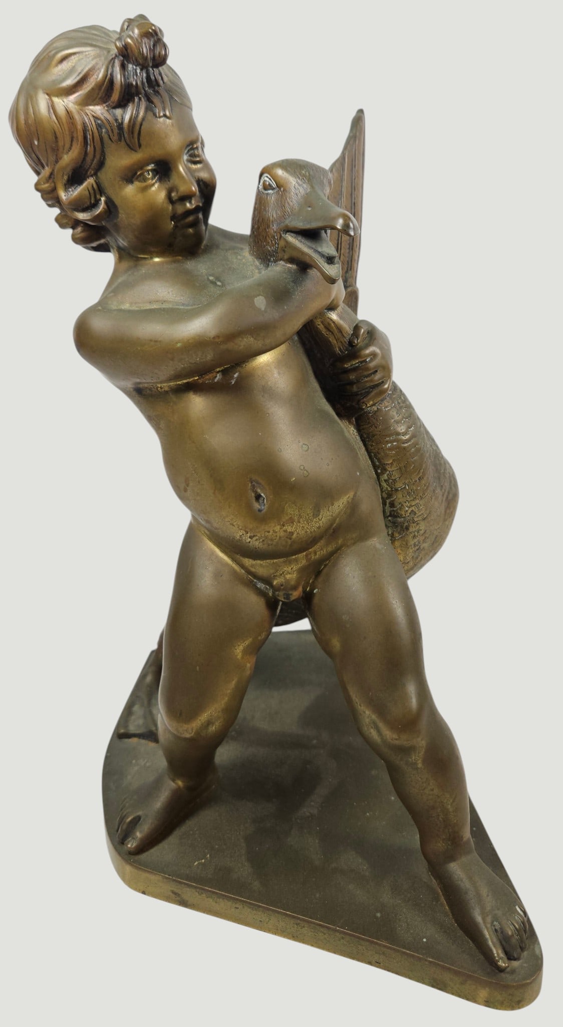 19th Century French Bronze of Boy with Goose: Depicting a young nude child playfully struggling with a goose. After the hellenistic original by the scupltor Boethus. Unmarked. Measures 10.5 inches high, 8.25 x 5 inches. Overall good condition,