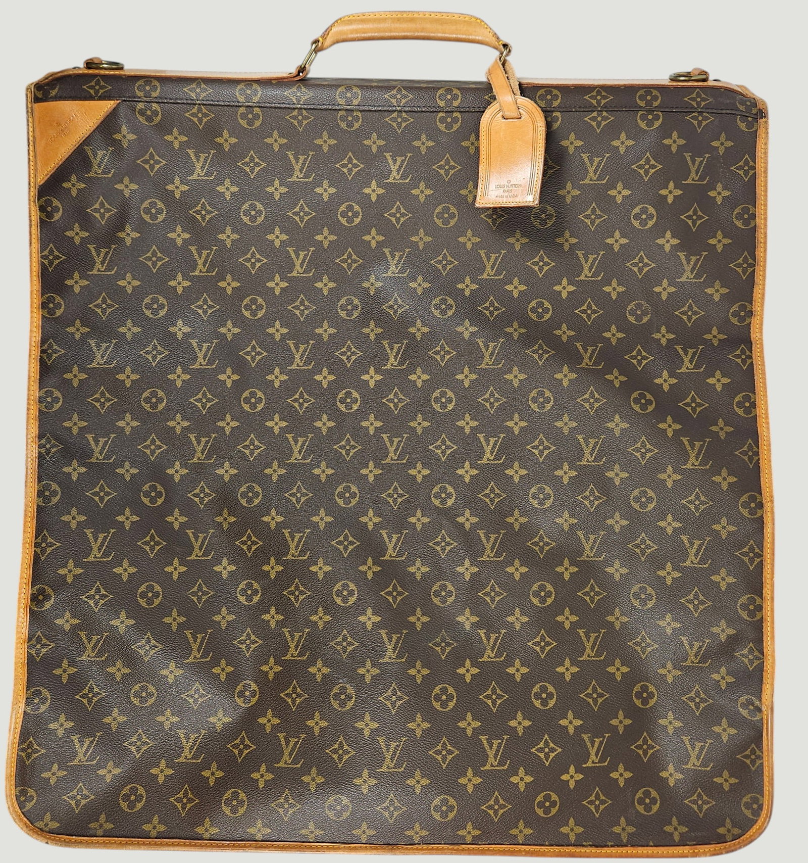 Louis Vuitton Monogram Folding Garment Bag: Louis Vuitton Garment Bag Suitcase, monogram leather with cowhide trim and three compartments. Measures 23 inches x 23 inches closed. Overall good condition, some discoloration around the edges,