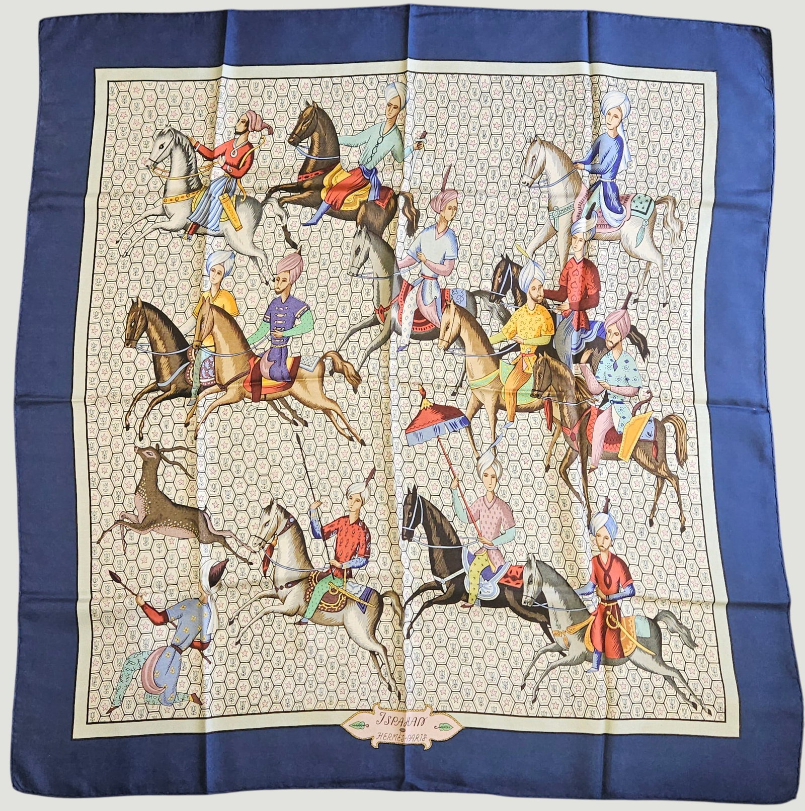 Hermes Ispahan Silk Scarf: Maurice Tranchant for Hermes (French, founded 1837), 1967. Silk "Ispahan" scarf in blue depicting several Iranian gentlemen riding horses dressed in colorful tack. 90cm x 90cm. Overall good