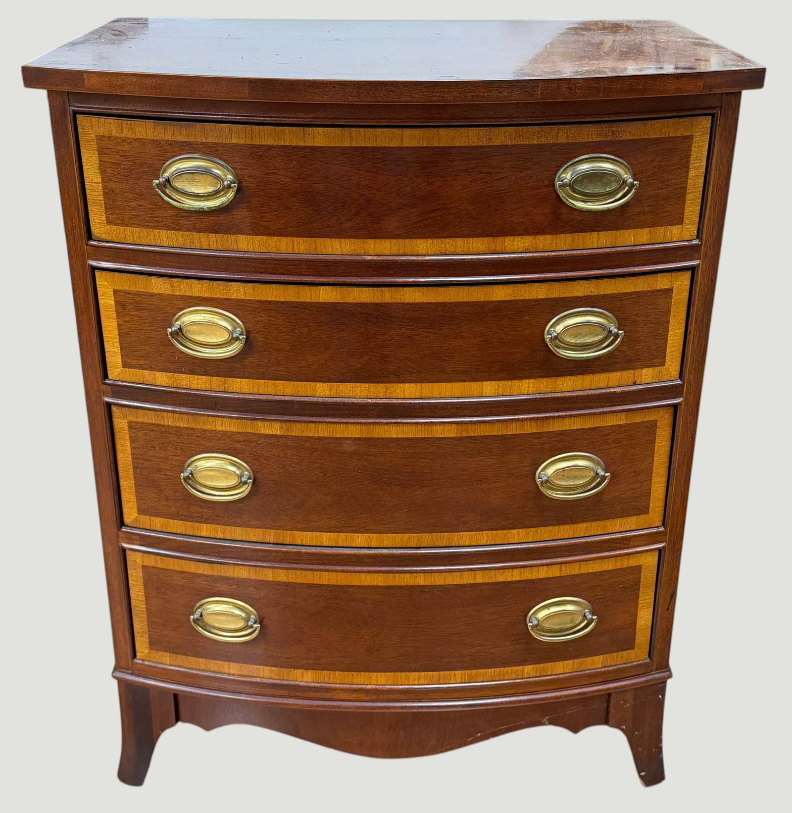 c1940 Mahogany Chippendale Style Banded Bow Front Bachelors Chest: Top with banded inlay, four banded drawers, straight bracket foot base. Measures 31 inches high, 24.5 inches wide, 16.5 inches deep. Overall good condition, some scratches to the top, please see photo