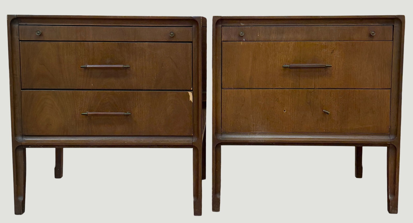 Pair Mid Century Modern United Furniture Company Nightstands: This elegant mid-century modern nightstand features a refined walnut finish and two spacious drawers under a pull out shelf, offering both style and functionality. Crafted by United Furniture in the