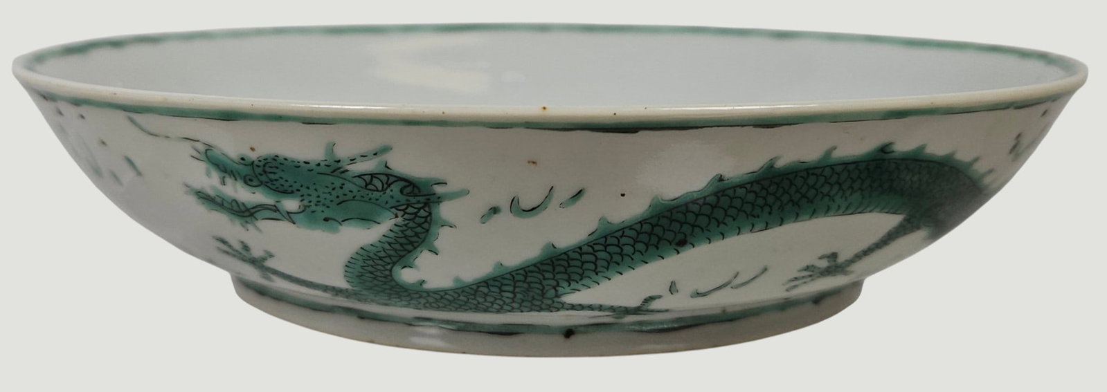 Chinese Qing Dynasty Green Enameled Dragon Dish: Measures 7.25 inches in diameter, 1.5 inches high. Overall good condition, no chips or cracks. Checked with a UV light. Please see photos.