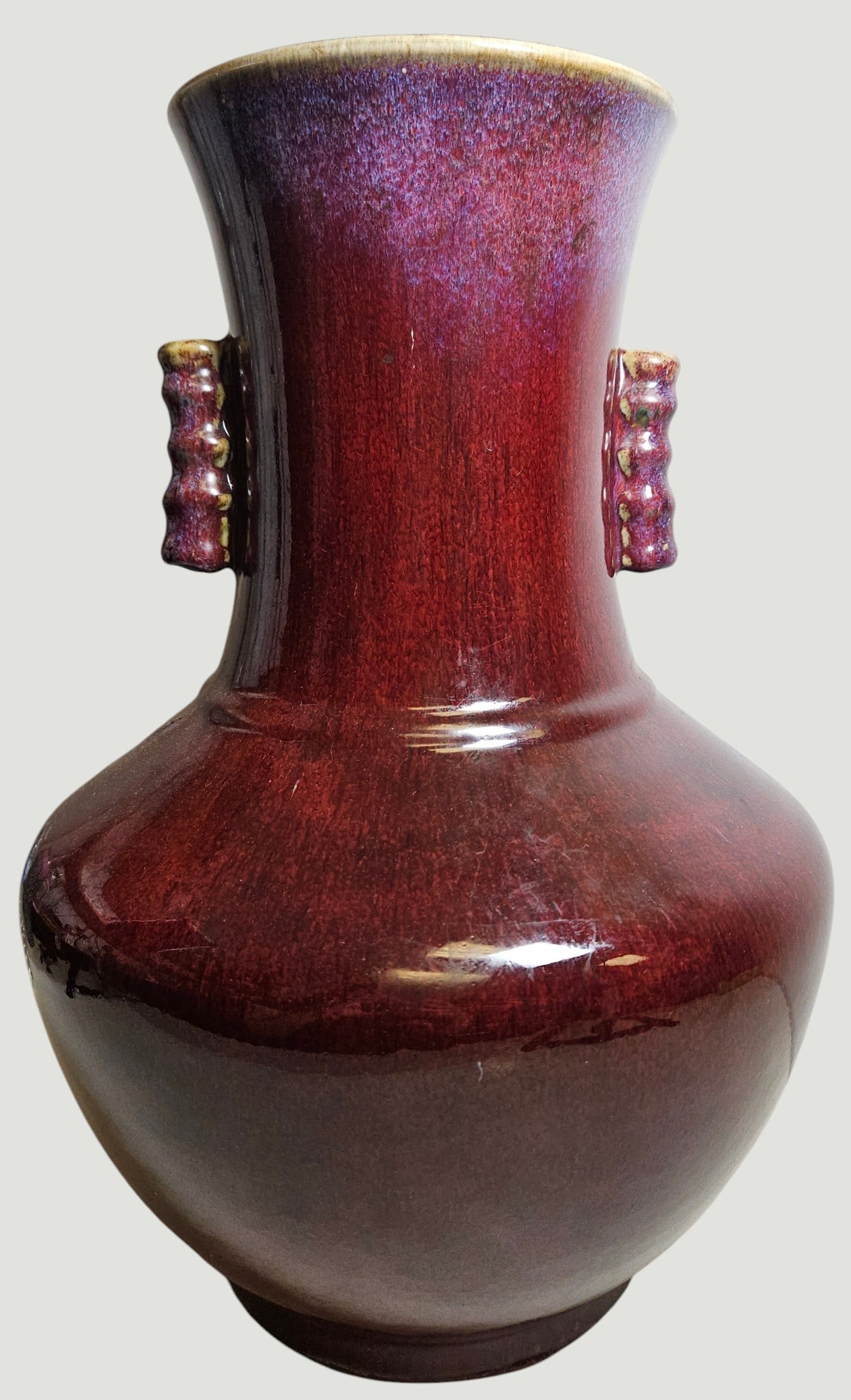 Large Qing Dynasty Oxblood Flambe Glaze Double Handled Hu Vase: Features a bulbous body, flared neck, and two tubular 'lug' handles on the sides. Measures 18 inches high, apporox 13 inches at its widest, and 74.25 inches across the top. Overall good condition, no
