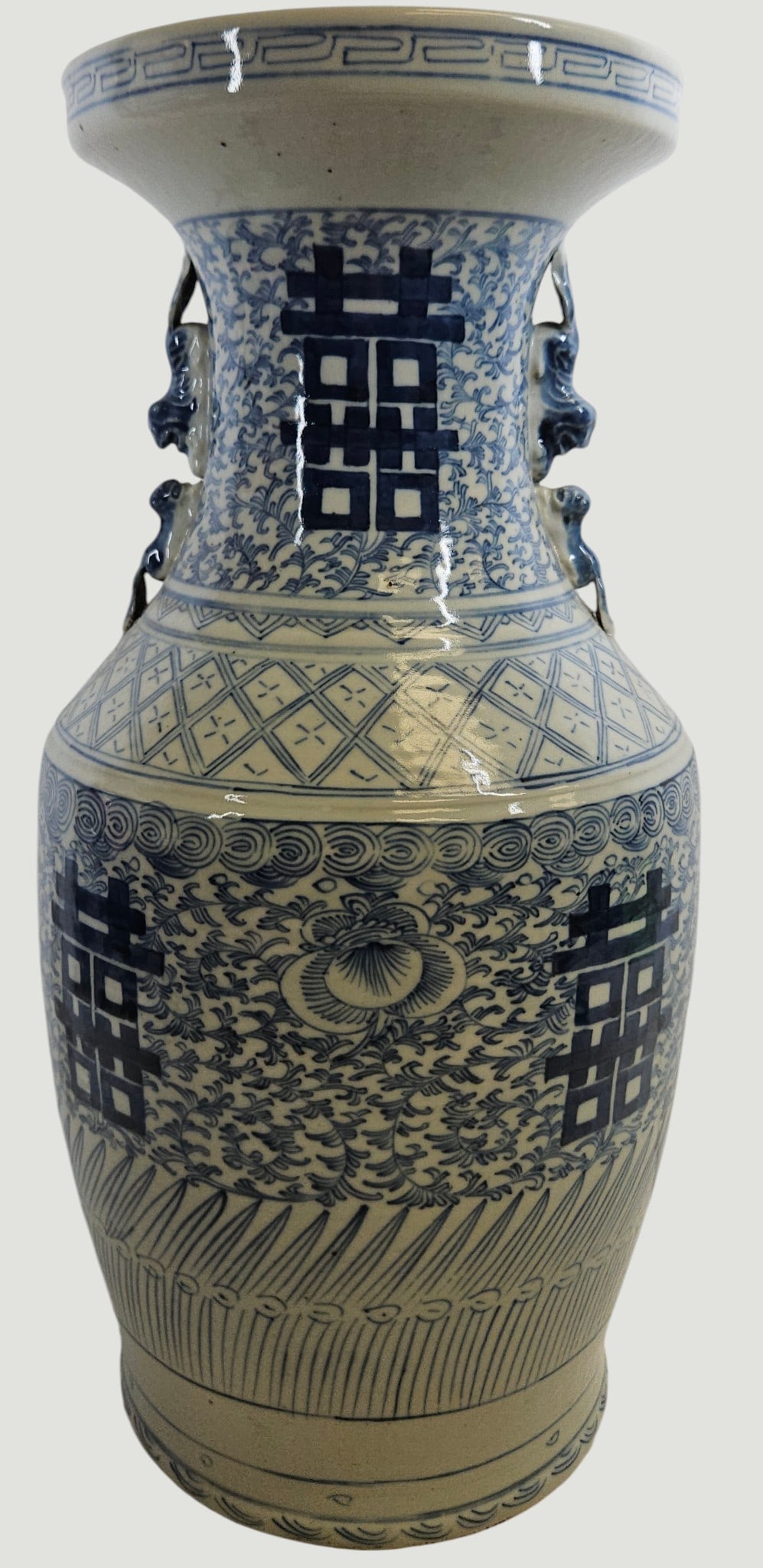 Large 19th Century Blue & White Double Happiness Vase: Baluster form rising to a flared trumpet neck, porcelain hand painted in underglaze blue with scrolling floral vines enclosing a central vertical panel of stylized auspicious Chinese characters,