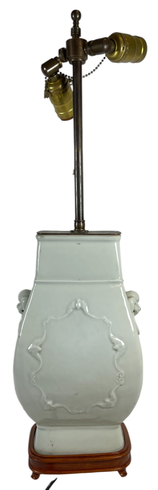 Chinese Monochrome Celadon Lamp with Applied Design: Very pale green with applied design. Porcelain measures 11.5 inches high, lamp measures approx 24 inhes to finial. Overall good condition, please see photos. Comes from an extensive collection of