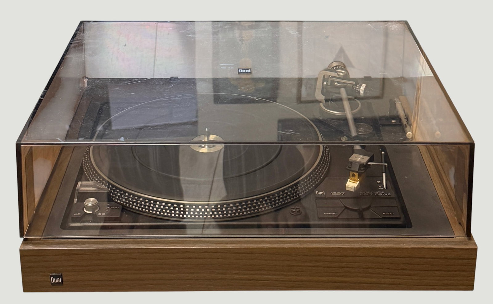 Dual 1257 Automatic Belt Drive Turntable: Manufactured between 1979 and 1981. Features two speeds, 33 and 45 rpm and includes pitch control. Overall light wear, working at time of description but not guaranteed.
