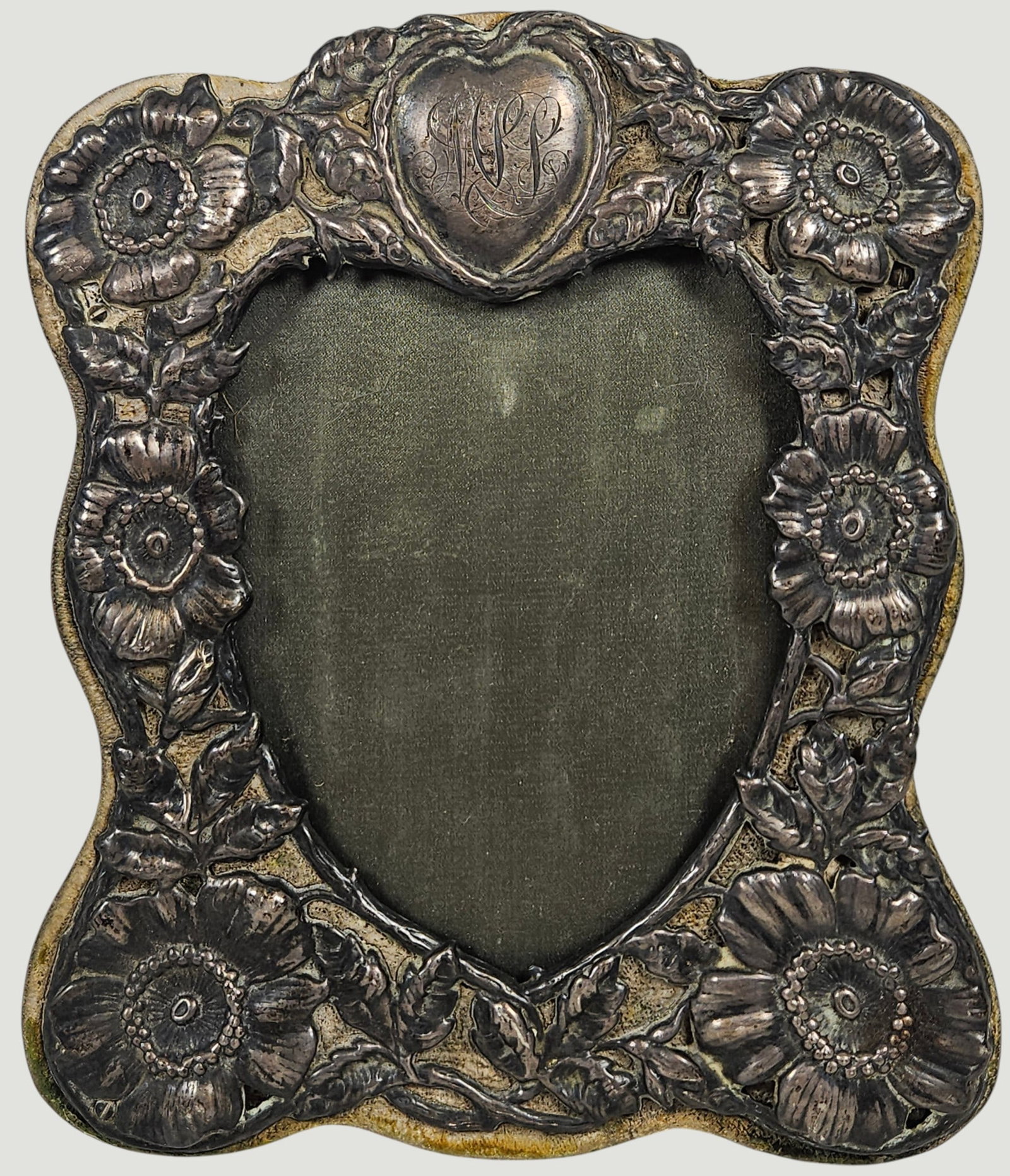 Art Nouveau Sterling SIlver Photo Frame: Marked sterling along the botrtom right. Measures 7 inches high, 6 inches wide. Overall good/fair condition, worn as expected with age. Please see photos.