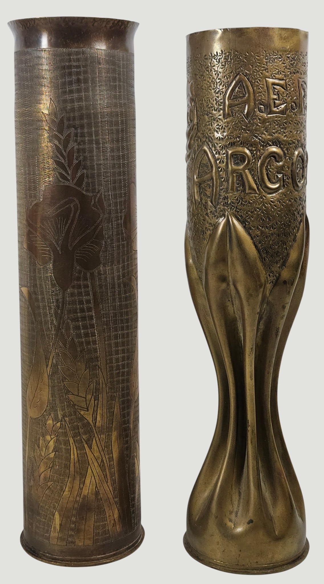 (2) WWI Trench Art Artillery Shell Vases: (1) is dated 1918 with a rose, (1) is etched with flowers with a geometric pattern behind. Both measure approx 13.5 inches high. Overall good condition, please see photos.