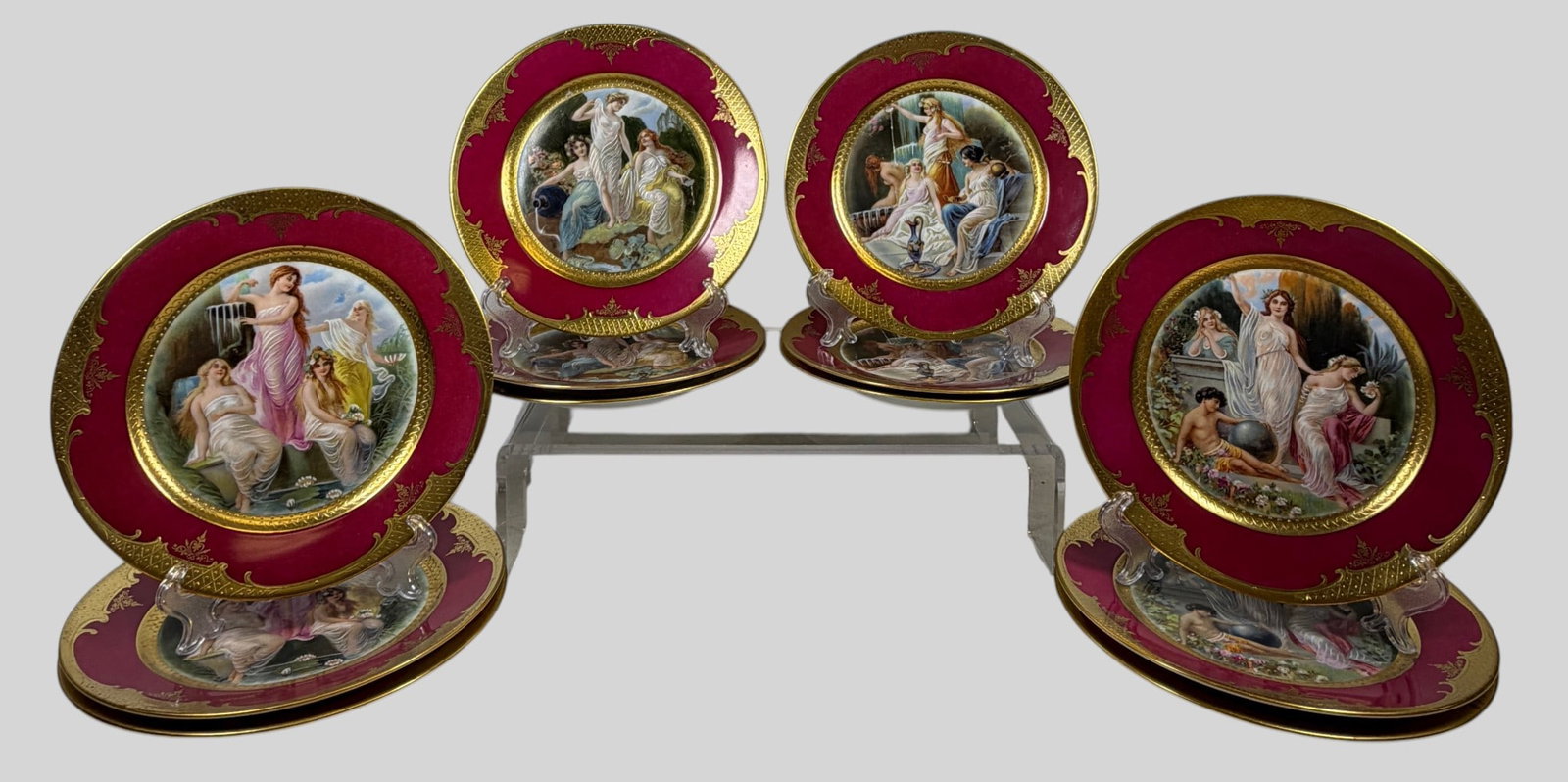 c1920 Royal Vienna Style Hand Painted Allegorical Set of (12) Porcelain Cabinet Plates: This exquisite three sets of (4) matching Art Deco-period (c. 1918–1938) Royal Vienna-style porcelain cabinet plates was manufactured by the Rudolf Kämpf factory in Grünlas, Bohemia, and finished 
