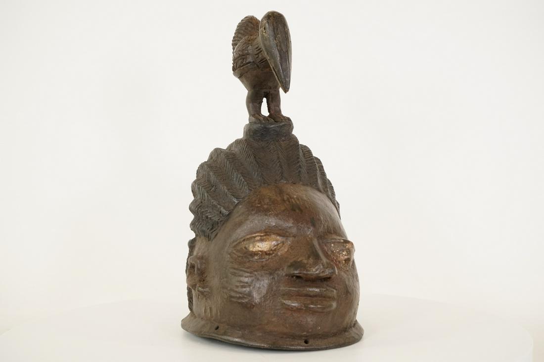 Yoruba Gelede Mask from Nigeria - African Tribal Art Sculpture: Measurements (inches) & Weight (pounds) Height: 15" Width: 6" Depth: 9" Weight: 4.5 lbs An attractive gelede mask with a bird figure on top. About the Gelede Mask Gelede is a cere