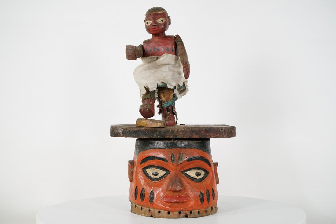 Yoruba Gelede Mask from Nigeria - African Tribal Art Sculpture: Measurements (inches) & Weight (pounds) Height: 19" Width: 11.5" Depth: 8.5" Weight: 6.5 lbs A brightly colored gelede mask with a puppet figure with articulated limbs on top. About the