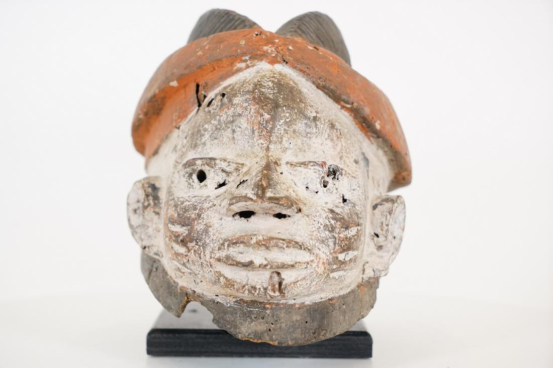 Yoruba Gelede Mask from Nigeria - African Tribal Art Sculpture: Measurements (inches) & Weight (pounds) Height: 7" Width: 7.5" Depth: 13" Weight: 1.5 lbs An interesting mask with white kaolin pigmentation and orange accents. Stand is not included. Ab