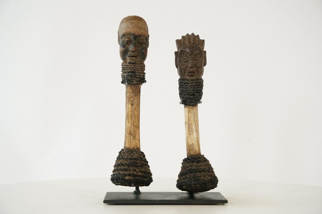 Yoruba Bone Figural Drum Sticks - Nigeria - African Tribal Art Sculpture: Measurements (inches) & Weight (pounds) Height: Left 8.75"; Right 8" Width: 2" and 6" with base Depth: Left 2"; Right 2.25" Weight: 1.5 lbs Two interesting bone figural drum sticks with human fac