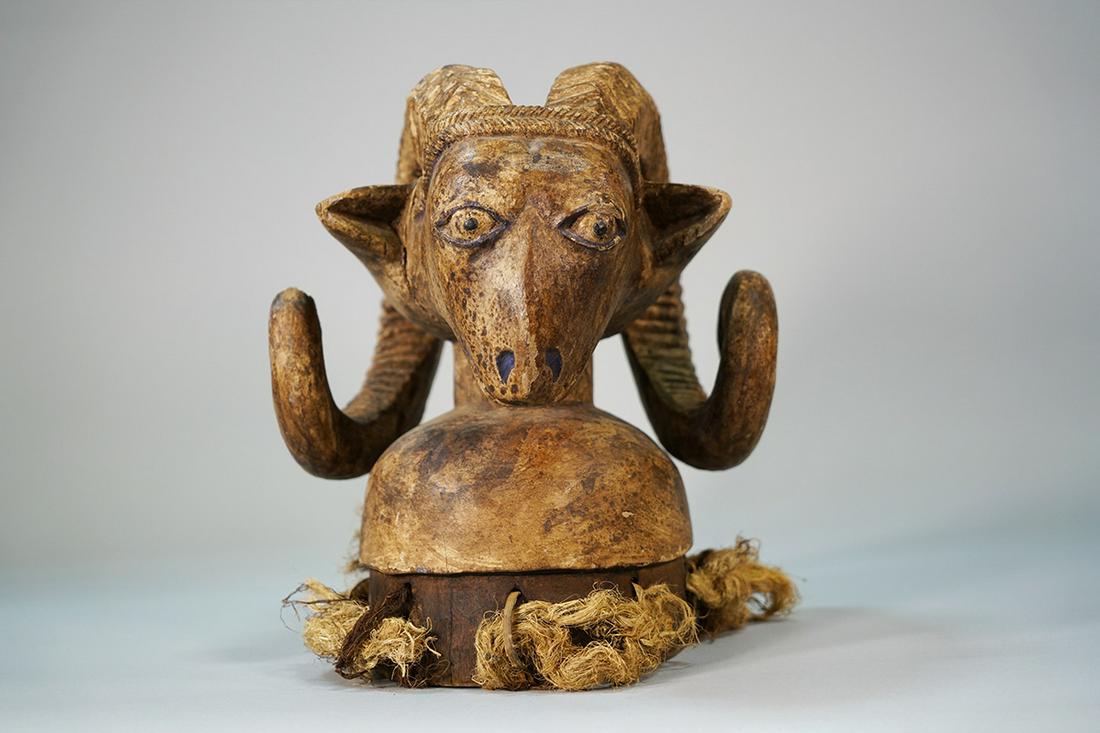 Yoruba Ram Mask from Nigeria - African Tribal Art: Measurements (inches) & Weight (pounds) Height: 12.5" Width: 10.5" Depth: 9.5" Weight: 5 lbs A beautiful Yoruba mask carved in the shape of a ram with large curved horns.
