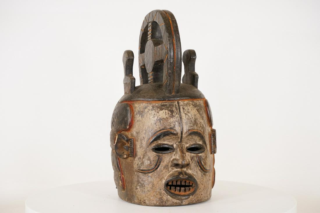 Igbo Maiden Spirit Mask from Nigeria - African Tribal Art: Measurements (inches) & Weight (pounds) Height: 17.5" Width: 8" Depth: 9.5" Weight: 3.5 lbs An eloborate maiden spirit helmet mask with hair picks on its coiffure. About Igbo Maiden Spir
