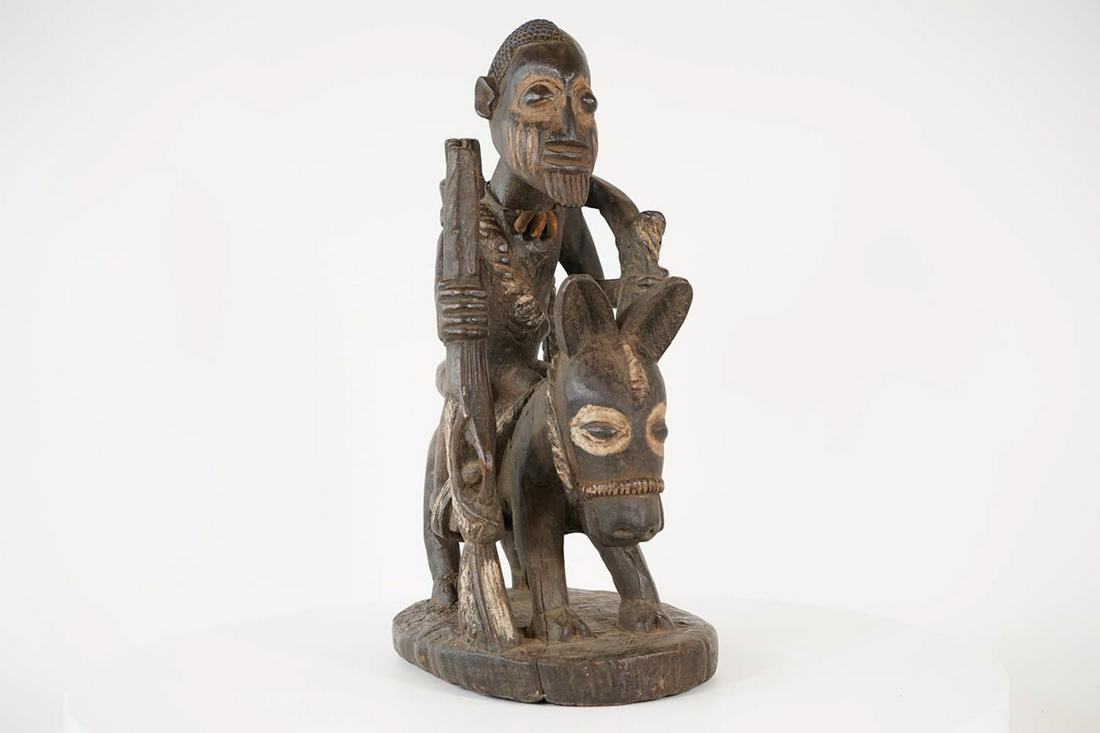 Yoruba Horse Rider Figure from Nigeria - African Tribal Art Sculpture: Measurements (inches) & Weight (pounds) Height: 17.5" Width: 7" Depth: 11" Weight: 6 lbs An elaborately carved Yoruba horse and rider figure featuring a male passenger holding a rifle.