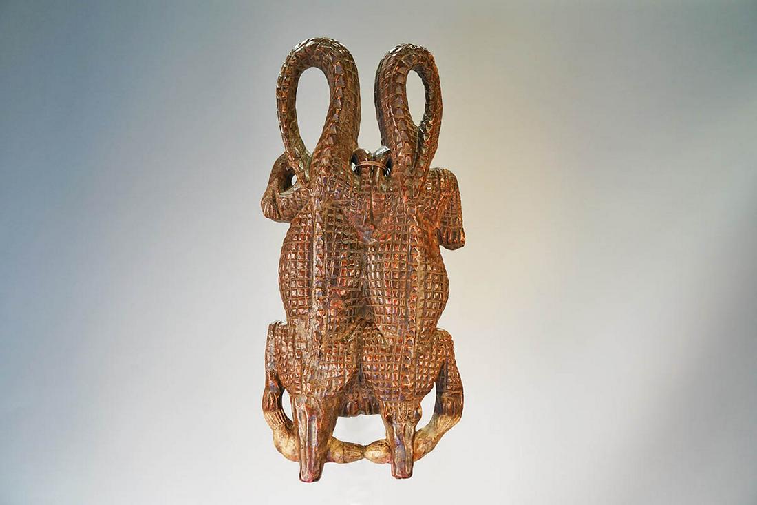 Yoruba Crocodile Mask from Nigeria - African Tribal Art: Measurements (inches) & Weight (pounds) Height: 31" Width: 14.5" Depth: 5.5" Weight: 11 lbs An attractive Yoruba mask featuring two crocodiles with highly detailed carved scales.