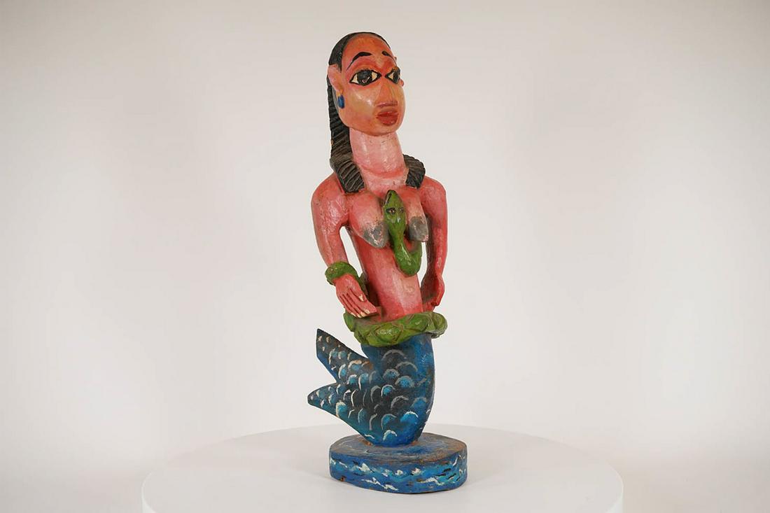 Nigerian Mami Wata Figure - African Tribal Art Sculpture: Measurements (inches) & Weight (pounds) Height: 22" Width: 5" Depth: 7" Weight: 5.5 lbs A colorful Nigerian Mami Wata figure featuring a mermaid with painted scales and a green snake wrapped aroun